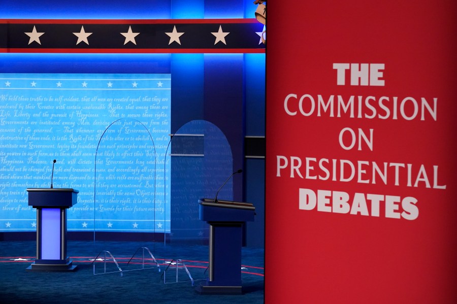 FILE - Clear protective panels stand onstage between lecterns as preparations take place for the second Presidential debate at Belmont University, Oct. 21, 2020, in Nashville, Tenn. Three debates for next year's presidential general election are set to be held in college towns in Texas, Virginia and Utah between Sept. 16 and Oct. 9, with the lone vice presidential debate happening in-between in Pennsylvania — though whether the Republican nominee will participate remains to be seen. The nonpartisan Commission on Presidential Debates announced Monday, Nov. 20, 2023, that presidential candidates will first be scheduled to meet Sept. 16. (AP Photo/Patrick Semansky, File)