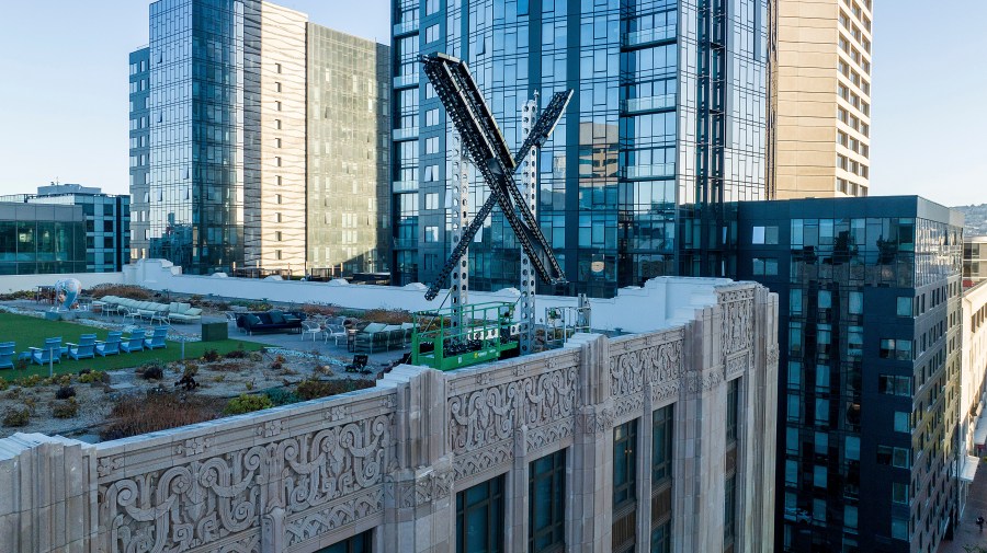 FILE - An "X" sign rests atop the company headquarters in downtown San Francisco, on July 28, 2023. Elon Musk's social media company, formerly known as Twitter, has filed a lawsuit against liberal advocacy group Media Matters for America. X says Media Matters manufactured a report to show advertisers' posts alongside neo-Nazi and white nationalist posts in order to "drive advertisers from the platform and destroy X Corp.” (AP Photo/Noah Berger, File)