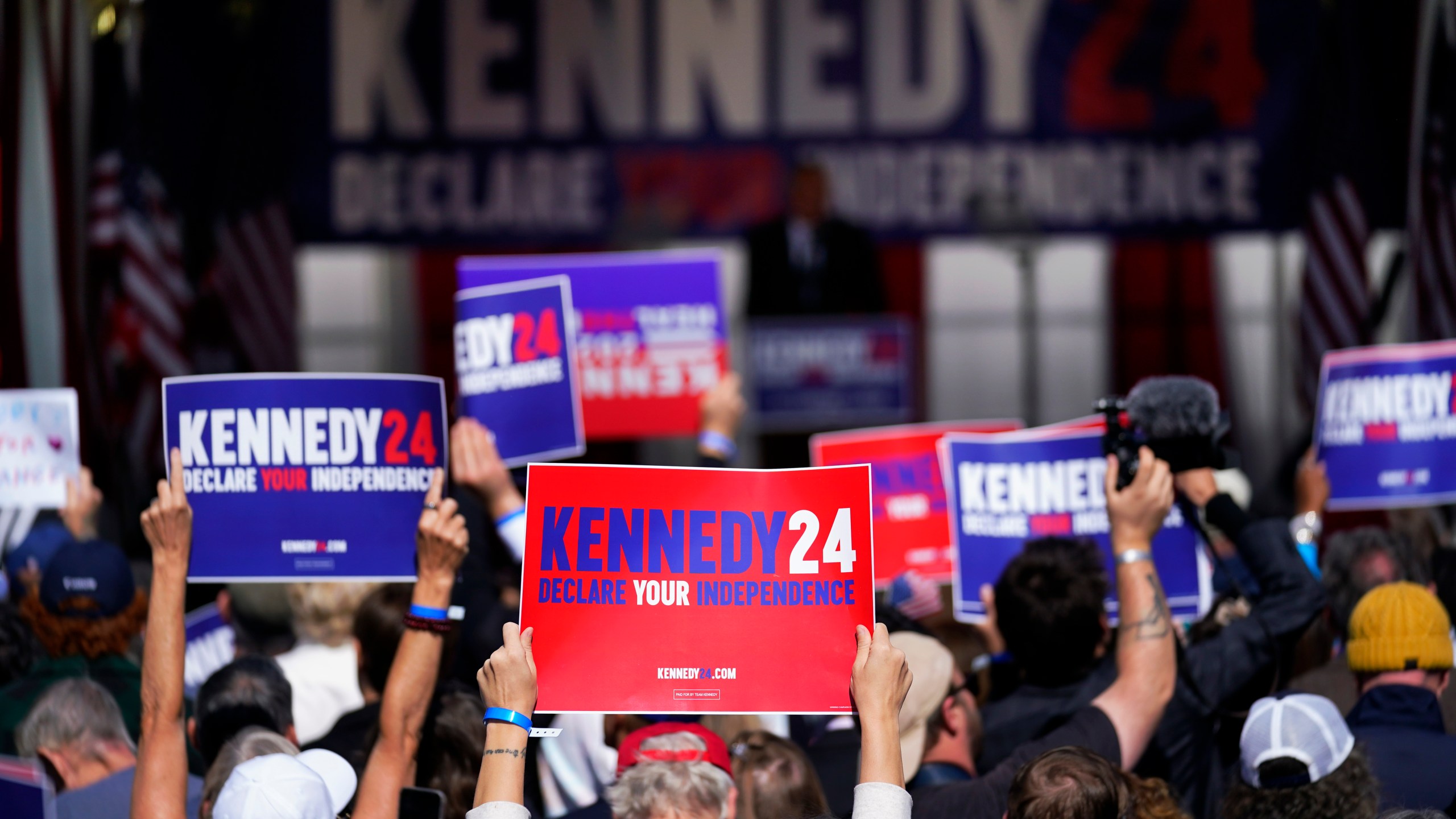 FILE - Supporters react as Independent presidential candidate Robert F. Kennedy Jr. speaks during a campaign event at Independence Mall, Oct. 9, 2023, in Philadelphia. The 60th anniversary of President John F. Kennedy's assassination, marked on Wednesday, Nov. 22, 2023, arrives at an unusual moment for the Kennedy family, one when its mission to uphold a legacy of public service and high ideals competes for attention with the presidential candidacy of Robert F. Kennedy Jr., whose anti-vaccine advocacy and inflammatory comments about everything from the Holocaust to the pandemic have led to a rare public family breach. (AP Photo/Matt Rourke, File)