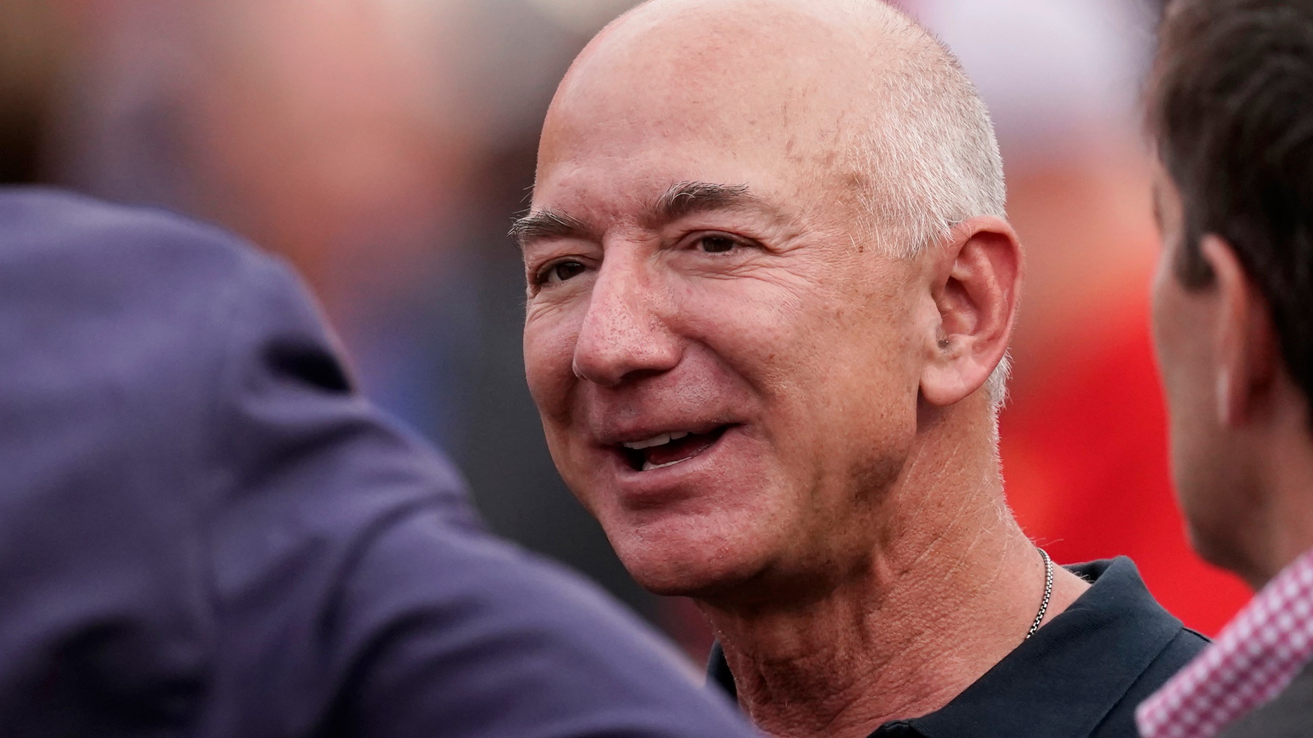 FILE - Amazon founder Jeff Bezos is seen on the sidelines before the start of an NFL football game between the Kansas City Chiefs and the Los Angeles Chargers Thursday, Sept. 15, 2022, in Kansas City, Mo. Bezos’ fund to support homeless families announced $117 million in new grants on Tuesday, Nov. 21, 2023 to organizations across the U.S. and Puerto Rico. The grants are a part of a $2 billion commitment Bezos made in 2018 to support homeless families and to run free preschools. (AP Photo/Charlie Riedel, File)