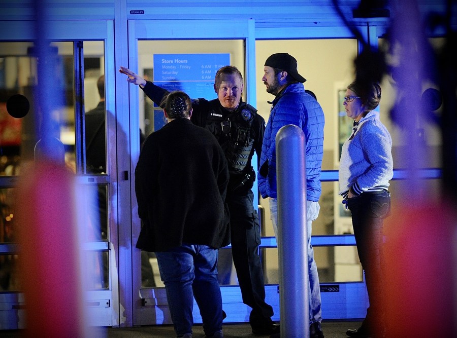 Police respond to the scene of a shooting on Monday, Nov. 20, 2023 in Beavercreek, Ohio. Police say a shooter opened fire at a Walmart, wounding four people before apparently killing himself. The attack took place Monday night at a Walmart in Beavercreek, in the Dayton metropolitan area. (Marshall Gorby/Dayton Daily News via AP)