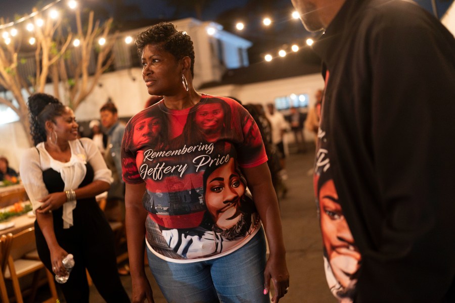 Jeffrey Price, right, and Yolanda Price, wearing T-shirts honoring Price Jr., attend a welcome dinner for the annual Families United 4 Justice Network Conference in the Studio City neighborhood of Los Angeles, Thursday, Sept. 28, 2023. Price Jr. was killed in a 2018 crash involving a police vehicle. The event was hosted by the Black Lives Matter Global Network Foundation at its mansion. (AP Photo/Jae C. Hong)