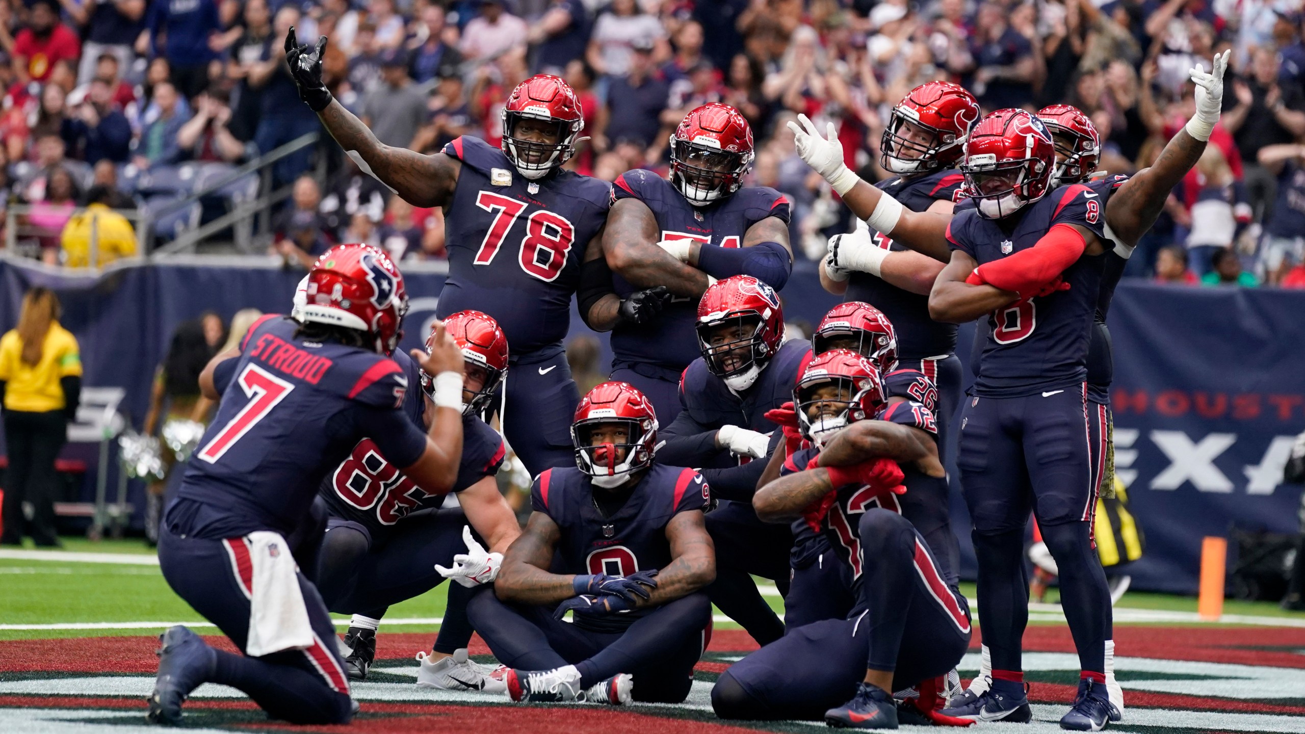 Houston Texans quarterback C.J. Stroud (7) pretends to take a picture as the team celebrates a touchdown scored by Devin Singletary in the first half of an NFL football game in Houston, Sunday, Nov. 19, 2023. (AP Photo/Eric Christian Smith)