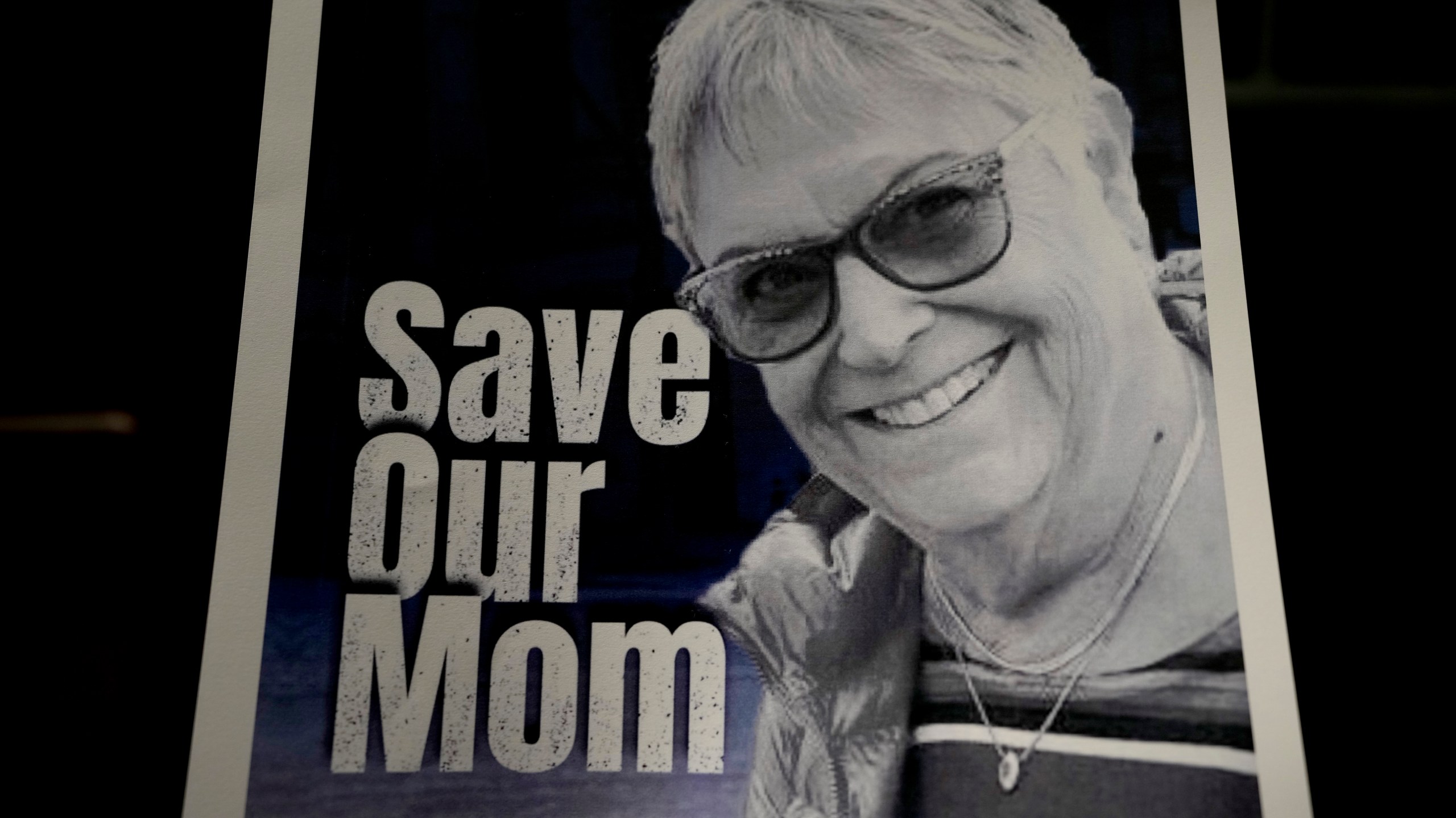 FILE - A poster of Ada Sagi, 75-year-old mother of Noam Sagi, is on display at a press conference of British children of Israeli hostages at a hotel in London, Thursday, Oct. 12, 2023. Noam Sagi, 53, is a London-based psychotherapist who grew up on Kibbutz Nir Oz. His 75-year-old mother, Ada Sagi, was taken hostage on October 7. Sharon Lifschitz, 52, is an artist and academic whose parents are peace activists aged 85 and 83 and were taken hostage too. (AP Photo/Kirsty Wigglesworth, File)