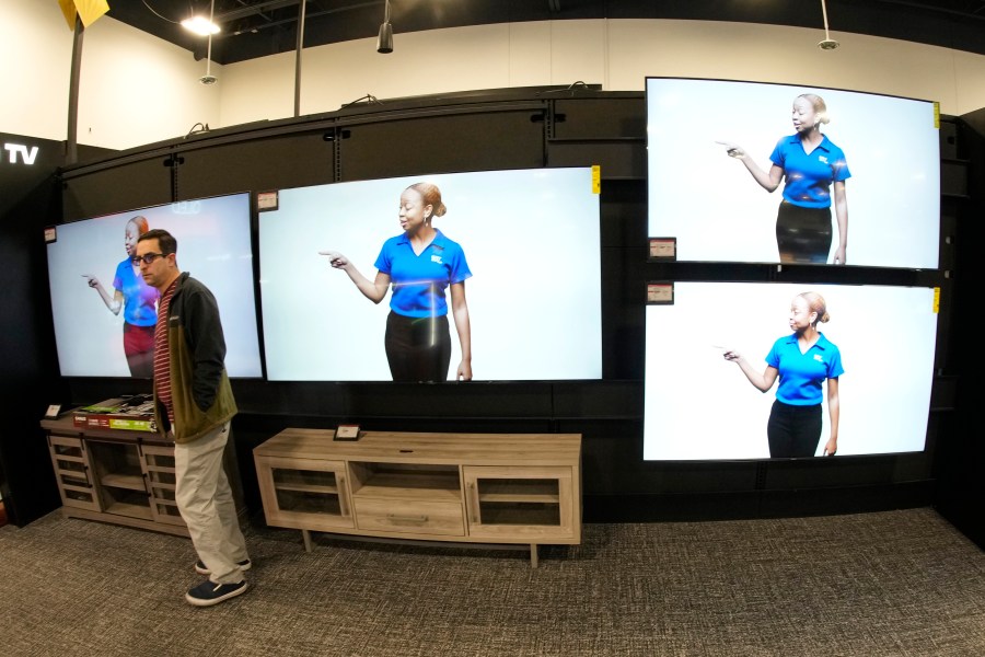 A customer turns away after looking at big-screen televisions on display in a Best Buy store Tuesday, Nov. 21, 2023, in southeast Denver. On Tuesday, the Conference Board reports on U.S. consumer confidence for November. (AP Photo/David Zalubowski)