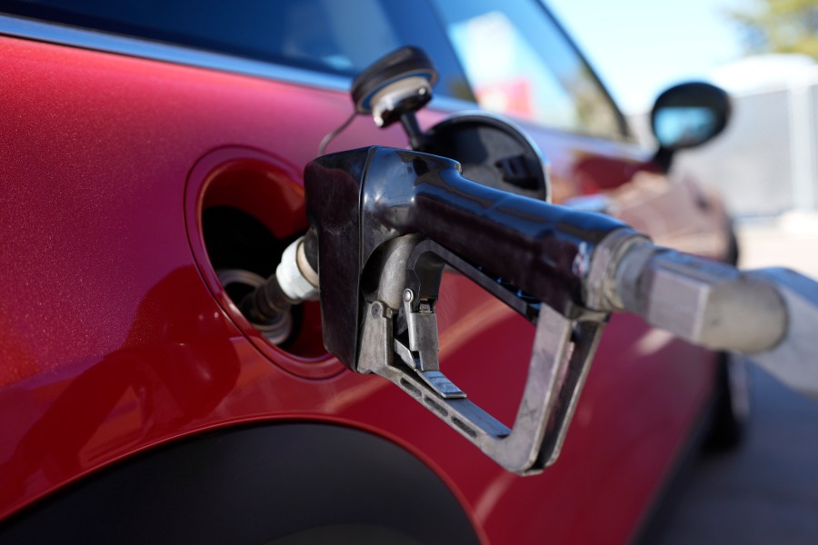 A motorist fills up the fuel tank of a vehicle at a Shell station Friday, Nov. 17, 2023, in Englewood, Colo. A big explanation for the recent decline in gas prices is seasonality — with prices at the pump almost always easing at this time of year. (AP Photo/David Zalubowski)