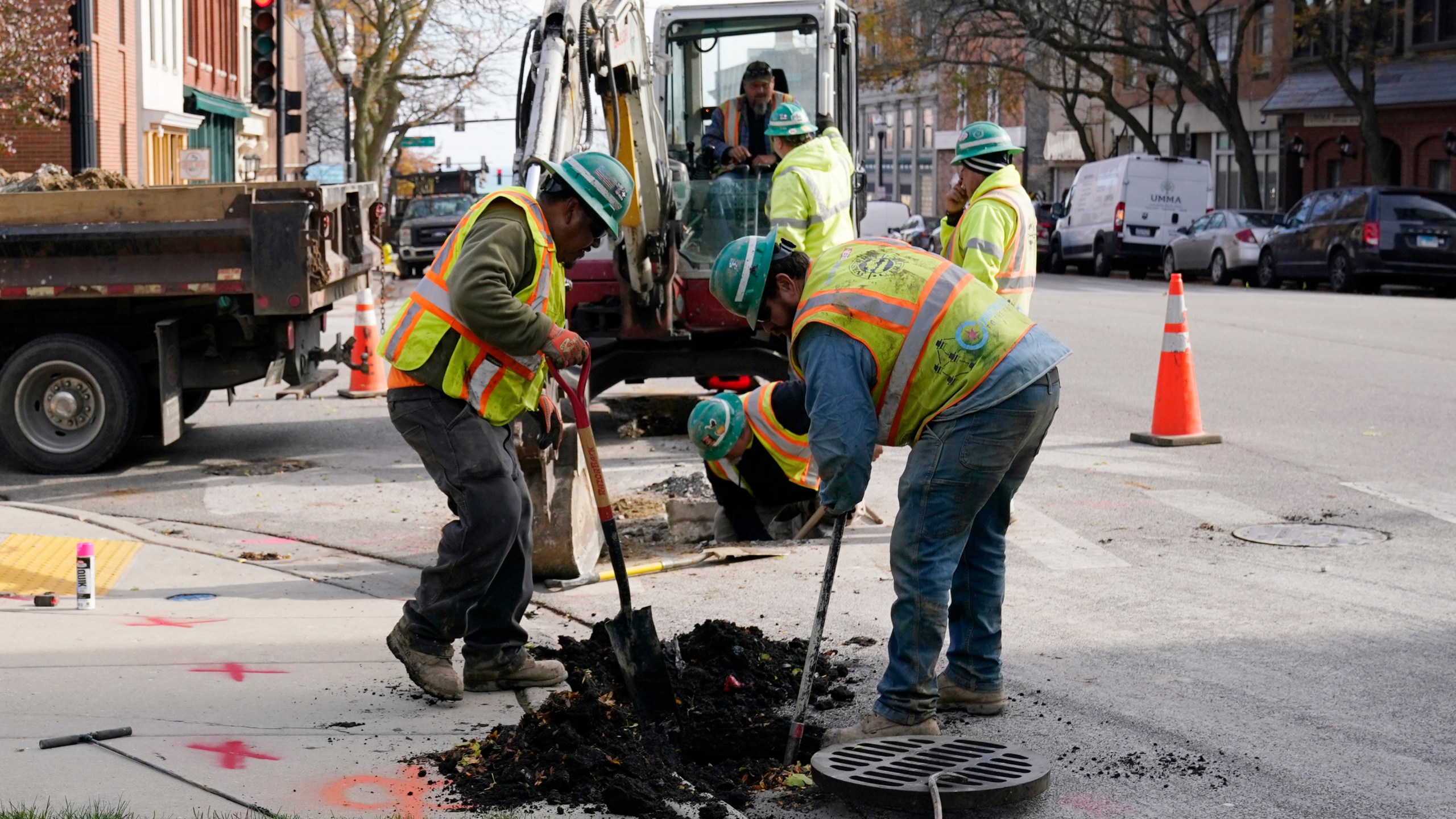 Workmen dig on a street in Waukegan, Ill., Monday, Nov. 6, 2023. On Wednesday, the Commerce Department issues its second of three estimates of how the U.S. economy performed in the third quarter of 2023. (AP Photo/Nam Y. Huh)