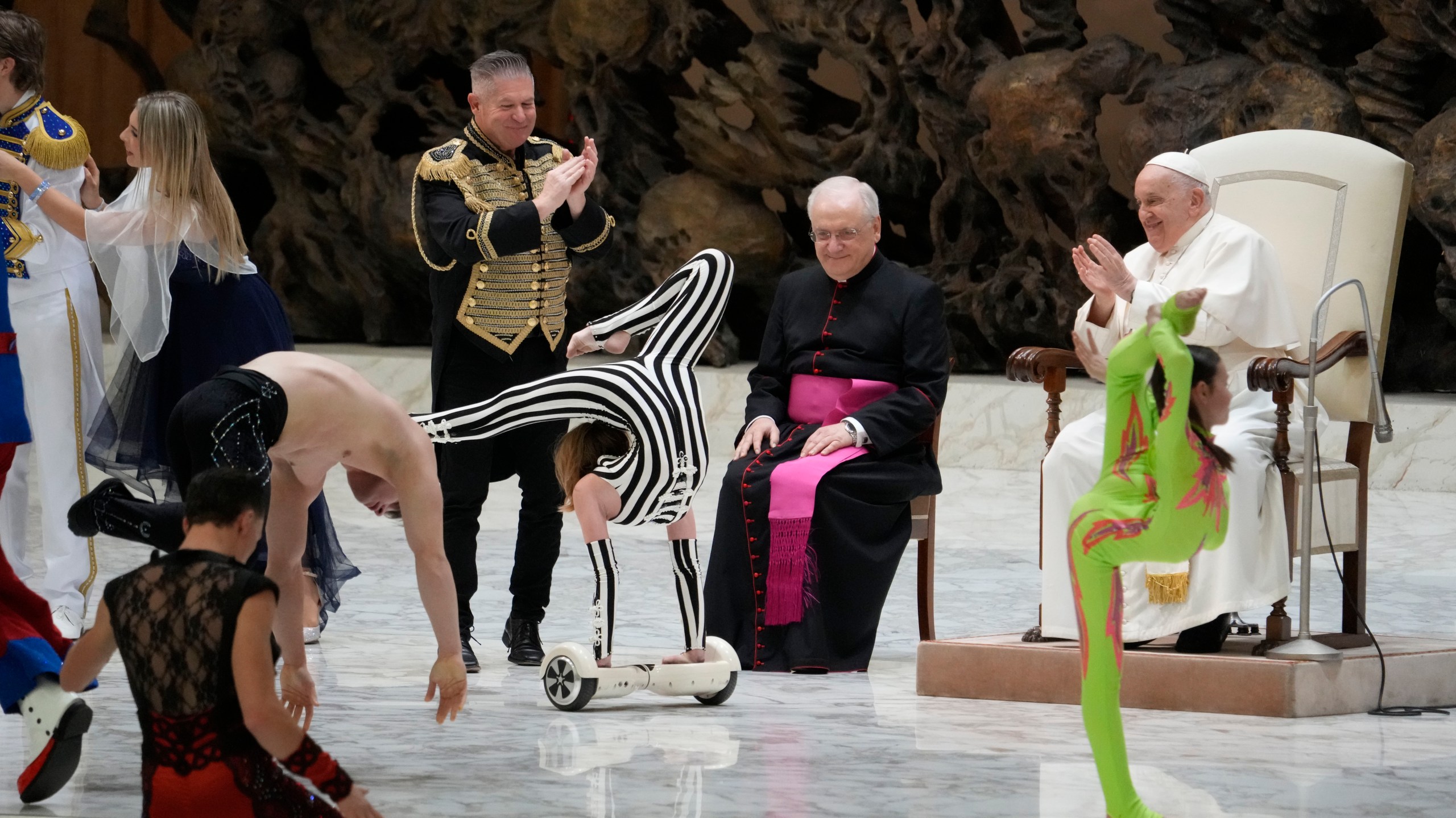 Participants to the Italian Circus festival perform in front of Pope Francis during the weekly general audience at the Vatican, Wednesday, Nov. 29, 2023. (AP Photo/Gregorio Borgia)