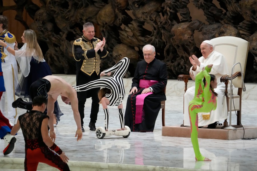 Participants to the Italian Circus festival perform in front of Pope Francis during the weekly general audience at the Vatican, Wednesday, Nov. 29, 2023. (AP Photo/Gregorio Borgia)