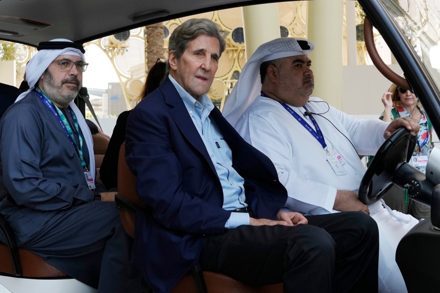 John Kerry, U.S. Special Presidential Envoy for Climate, rides in a cart ahead of the COP28 U.N. Climate Summit, Wednesday, Nov. 29, 2023, in Dubai, United Arab Emirates. (AP Photo/Peter Dejong)