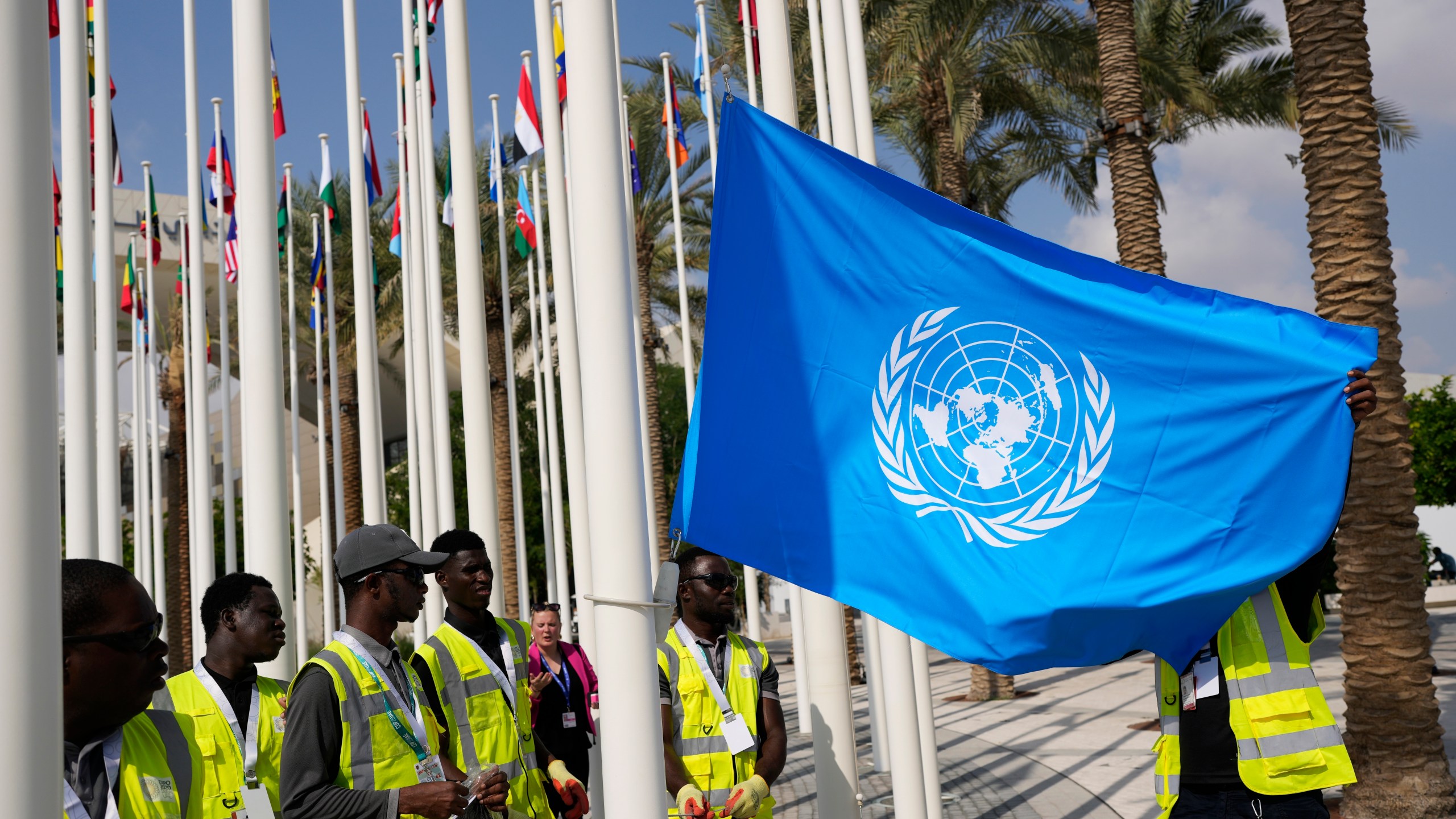 FILE - The United Nations flag is adjusted ahead of the COP28 U.N. Climate Summit, Wednesday, Nov. 29, 2023, in Dubai, United Arab Emirates. (AP Photo/Rafiq Maqbool, File)