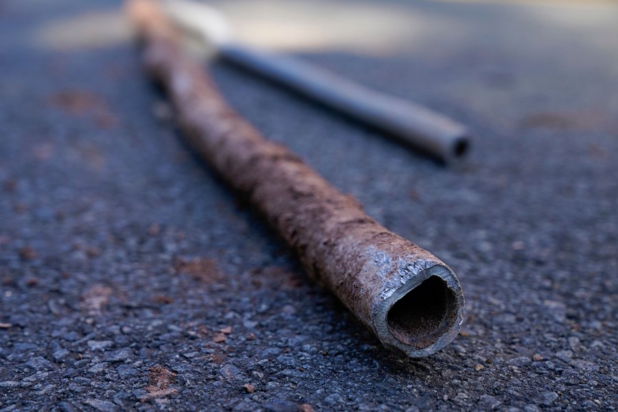 FILE - Lead water pipes pulled from underneath the street are seen in Newark, N.J., Oct. 21, 2021. (AP Photo/Seth Wenig, File)