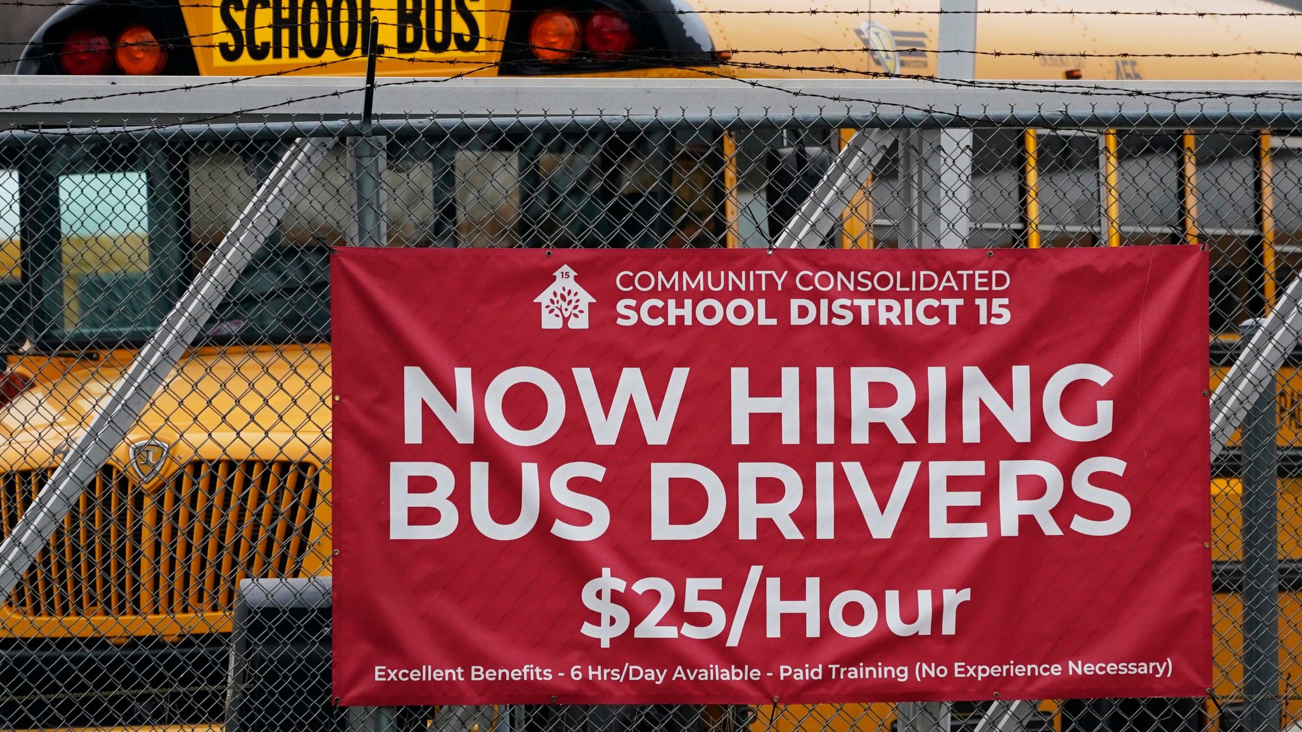 A hiring sign is displayed at a school in Palatine, Ill., Wednesday, Nov. 8, 2023. On Thursday, the Labor Department reports on the number of people who applied for unemployment benefits last week. (AP Photo/Nam Y. Huh)