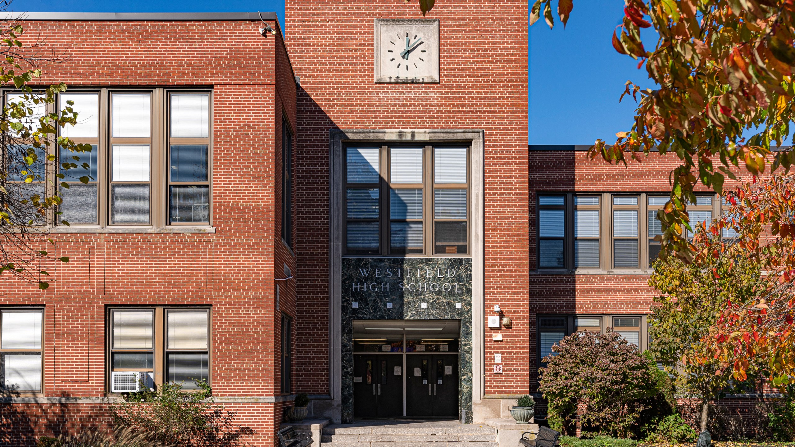 The main entrance of Westfield High School in Westfield, N.J. is shown on Wednesday, Nov. 8, 2023. AI-generated nude pictures were created using the faces of some female students at the school and then circulated among a group of friends on the social media app Snapchat. (AP Photo/Peter K. Afriyie)