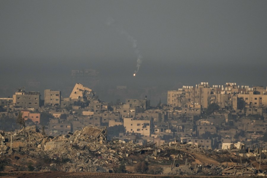 An Israeli army flare is seen over the Gaza Strip, as seen from southern Israel, Sunday, Dec. 3, 2023. (AP Photo/Leo Correa)