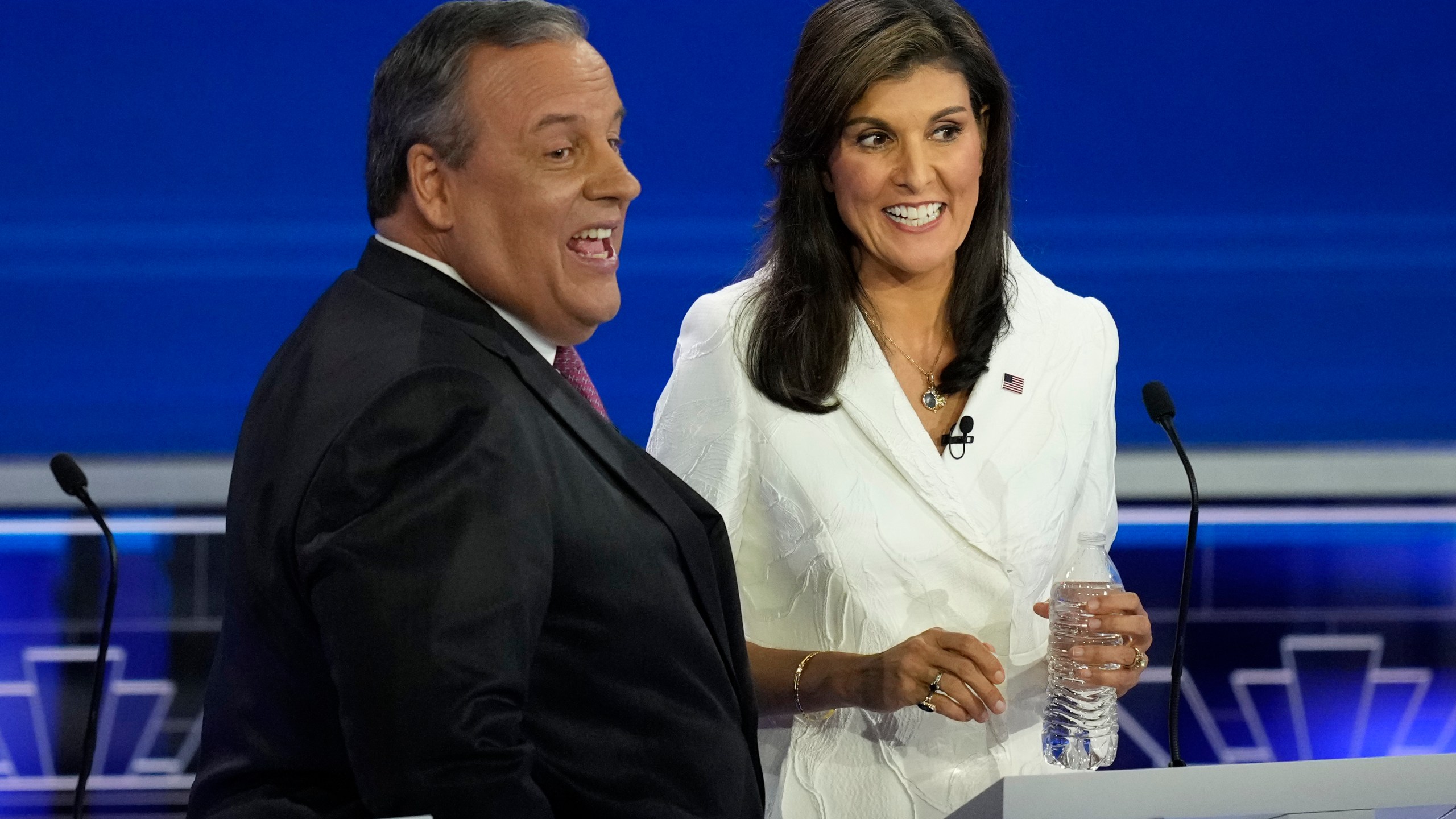 Republican presidential candidates former U.N. Ambassador Nikki Haley talks with former New Jersey Gov. Chris Christie during a break at the Republican presidential primary debate hosted by NBC News, Wednesday, Nov. 8, 2023, at the Adrienne Arsht Center for the Performing Arts of Miami-Dade County in Miami. (AP Photo/Rebecca Blackwell)