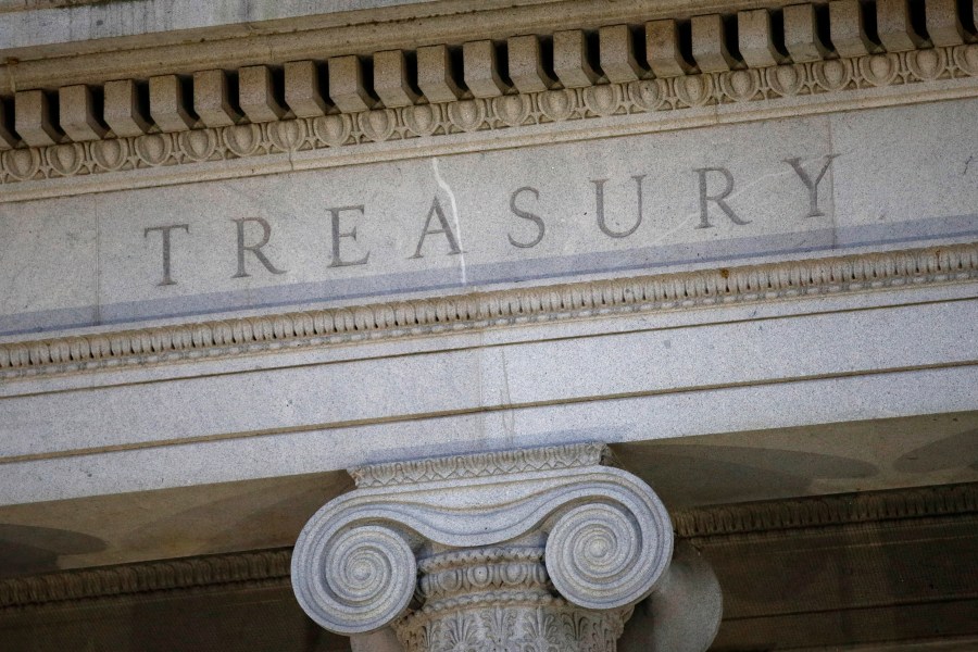 FILE- The U.S. Treasury Department building is shown at dusk in Washington on June 6, 2019. The U.S. on Tuesday, Dec. 5, 2023, imposed sanctions on a Belgian involved in procuring electronics for the Russian military, his companies and a group of Belarusian firms and people tied to Russia's invasion of Ukraine. (AP Photo/Patrick Semansky, File)