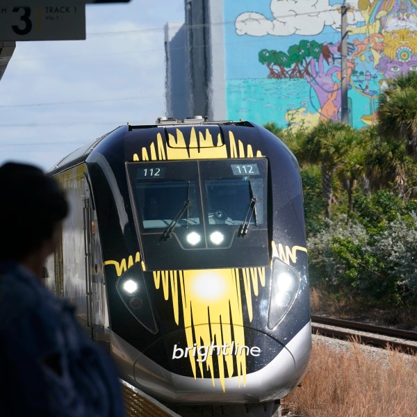 FILE - A Brightline train approaches the Fort Lauderdale station on Sept. 8, 2023, in Fort Lauderdale, Fla. A high-speed rail line between Las Vegas and the Los Angeles area is getting a Biden administration pledge of $3 billion to help start laying track. Nevada's two Democratic U.S. senators said Tuesday, Dec. 5, 2023 the $12 billion project led by Brightline West has all required right-of-way, environmental and labor approvals. (AP Photo/Marta Lavandier, file)