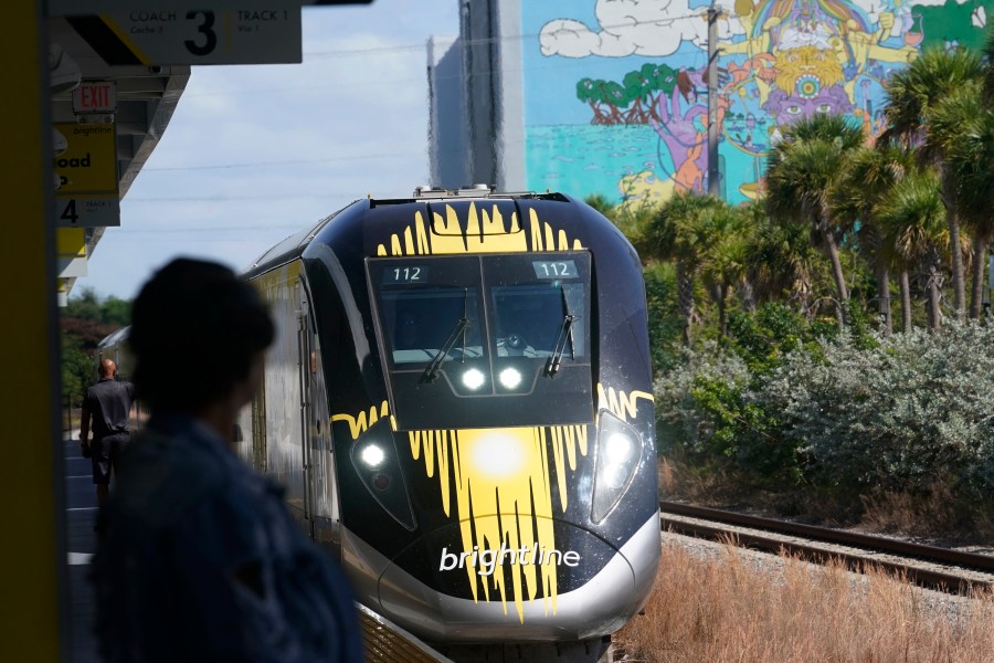 FILE - A Brightline train approaches the Fort Lauderdale station on Sept. 8, 2023, in Fort Lauderdale, Fla. A high-speed rail line between Las Vegas and the Los Angeles area is getting a Biden administration pledge of $3 billion to help start laying track. Nevada's two Democratic U.S. senators said Tuesday, Dec. 5, 2023 the $12 billion project led by Brightline West has all required right-of-way, environmental and labor approvals. (AP Photo/Marta Lavandier, file)