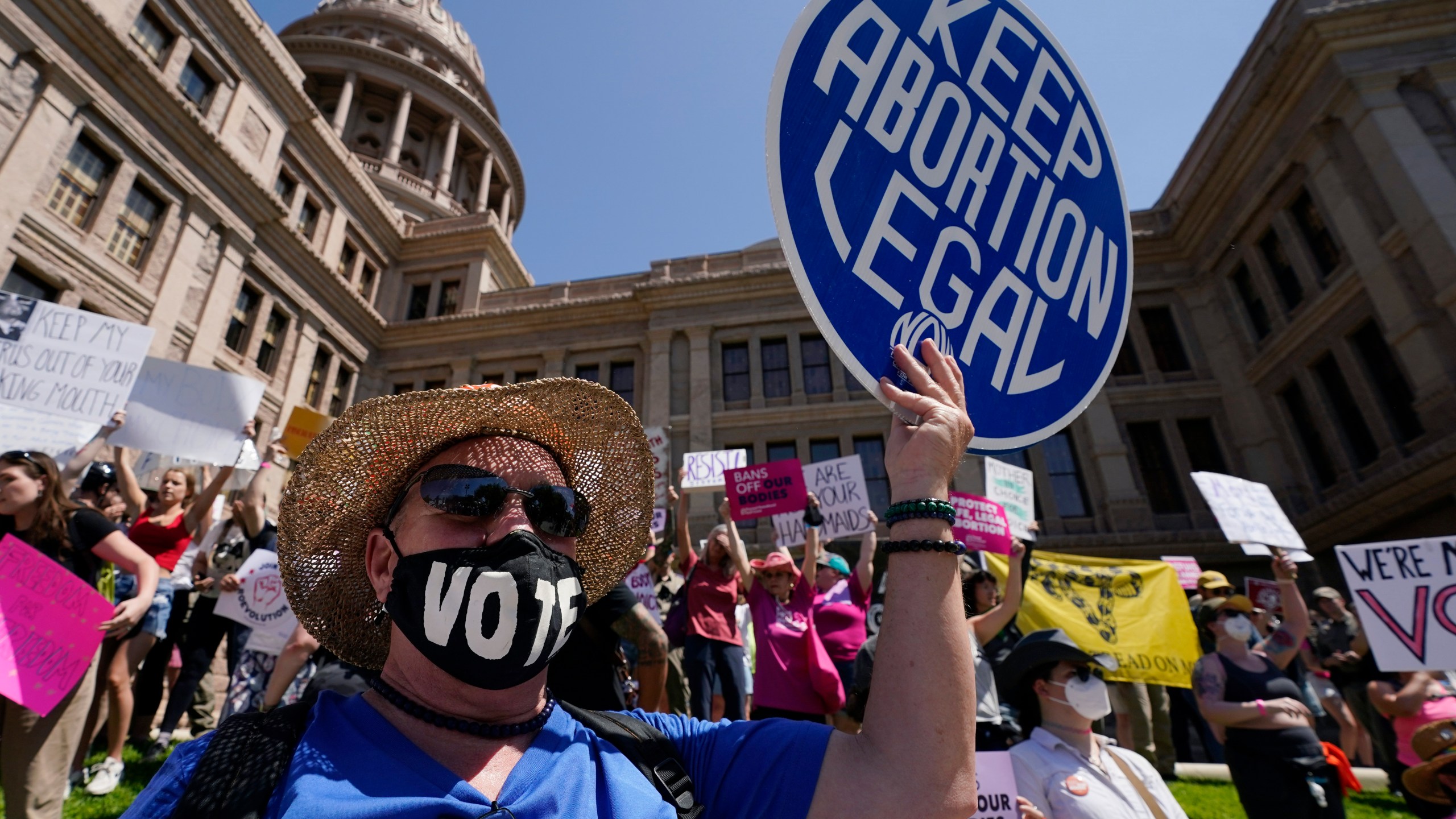 FILE - Abortion rights demonstrators attend a rally at the Texas state Capitol in Austin, Texas, May 14, 2022. A pregnant Texas woman whose fetus has a fatal diagnosis asked a court Tuesday, Dec. 5, 2023, to let her terminate the pregnancy, bringing what her attorneys say is the first lawsuit of its kind in the U.S. since Roe v. Wade was overturned last year.(AP Photo/Eric Gay, File)