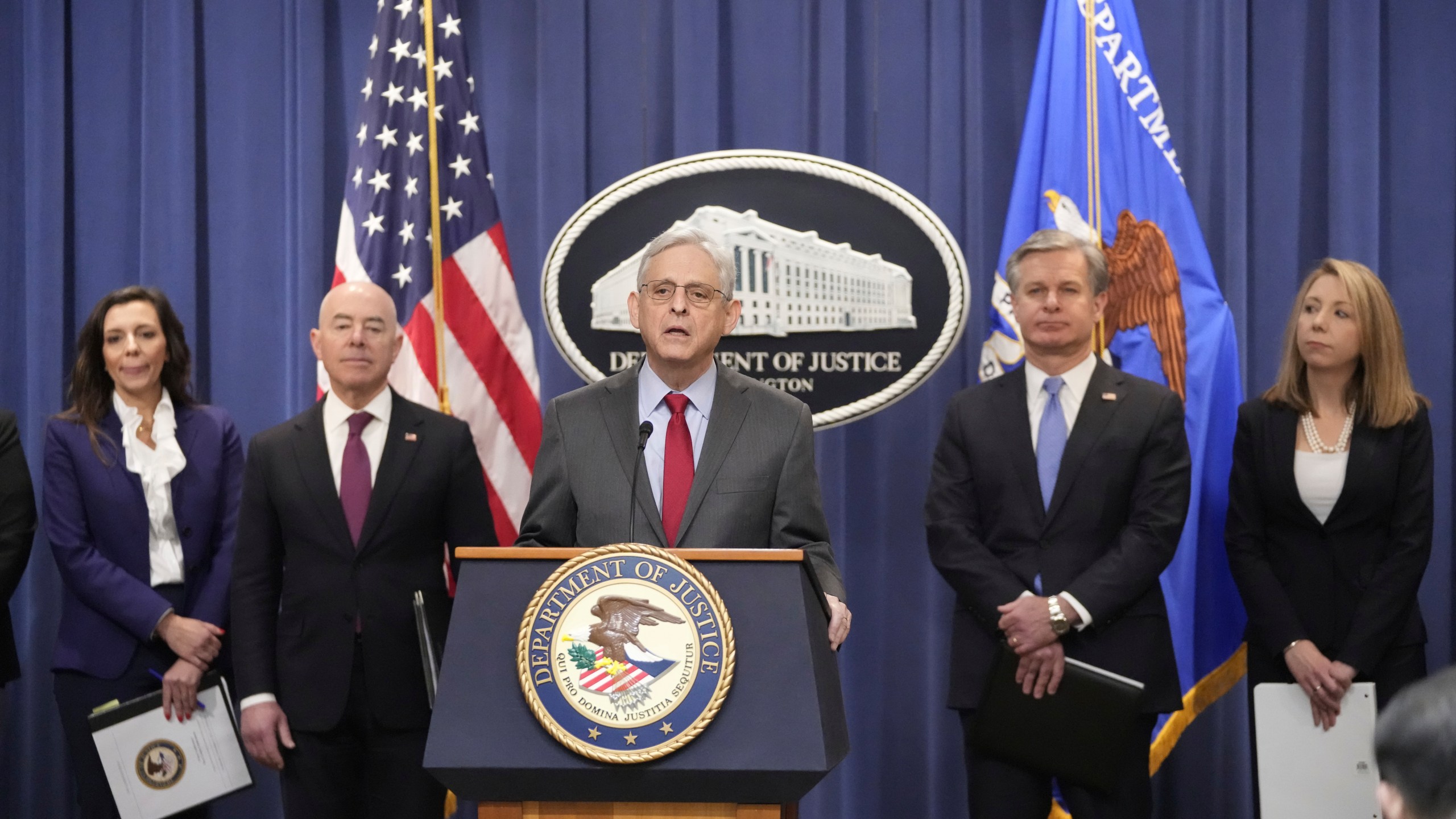 Attorney General Merrick Garland speaks with reporters during a news conference at the Department of Justice, Wednesday, Dec. 6, 2023, in Washington, with from left, Assistant Attorney General Nicole M. Argentieri of the Criminal Division, Secretary of Homeland Security Alejandro Mayorkas, FBI Director Christopher Wray and U.S. Attorney Jessica Aber for the Eastern District of Virginia. (AP Photo/Mark Schiefelbein)