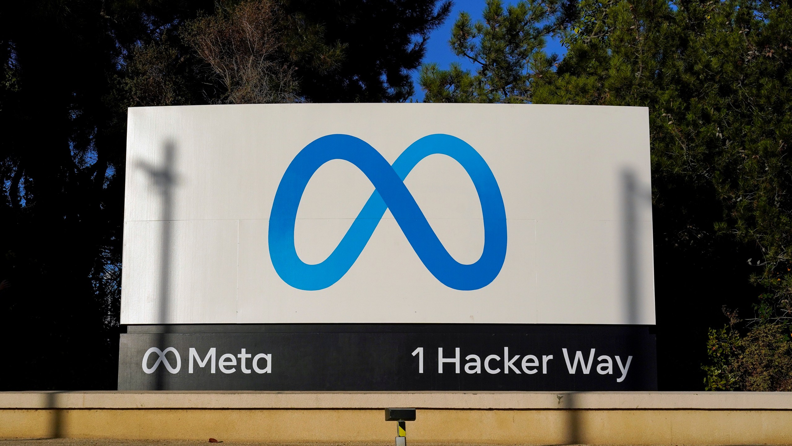 FILE - Meta's logo is seen on a sign, Nov. 9, 2022, at the company's headquarters in Menlo Park, Calif. Facebook and Instagram fail to protect underage users from exposure to child sexual abuse material and let adults solicit pornographic imagery from them, New Mexico's attorney general alleges in a lawsuit filed Tuesday, Dec. 5, 2023, that follows an undercover online investigation into Meta’s social media platforms. (AP Photo/Godofredo A. Vásquez, File)