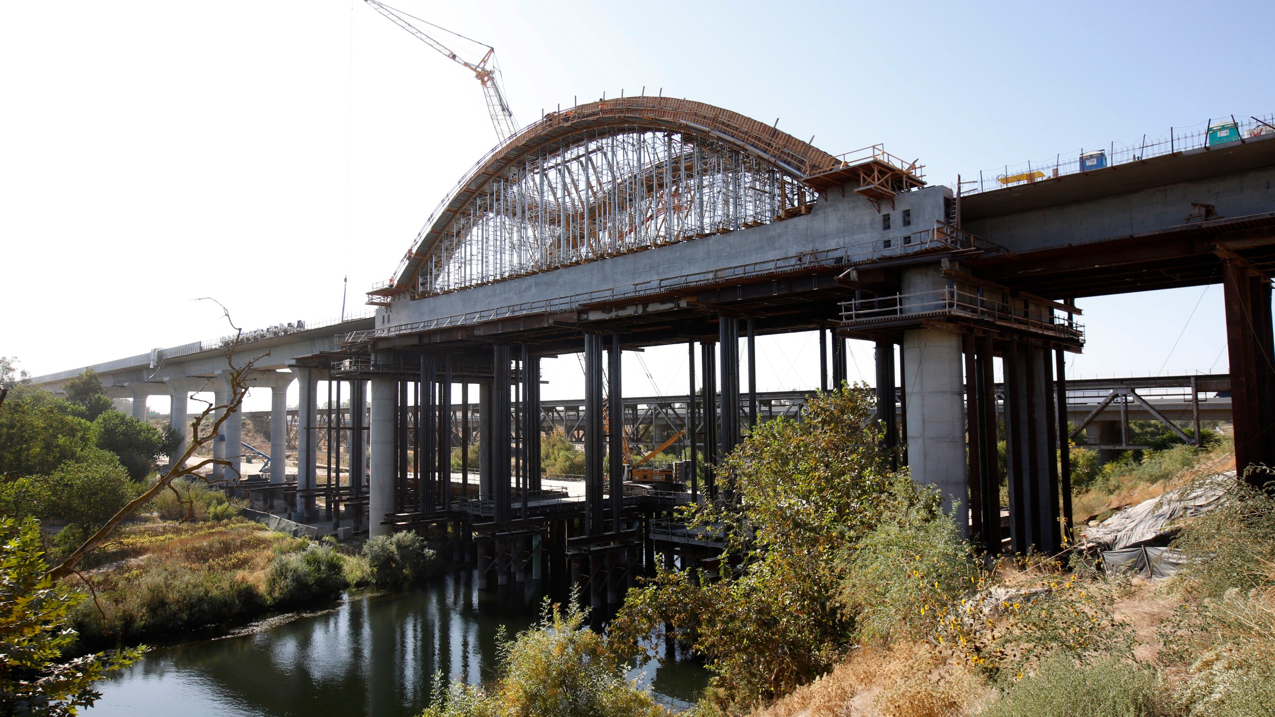 FILE - The high-speed rail viaduct is seen under construction over the San Joaquin River near Fresno, Calif., on Oct. 9, 2019. The Biden administration on Tuesday, Dec. 5, 2023, announced it would give $6 billion to two high-speed electric rail projects on the West Coast. The funding includes more than $3 billion for the route connecting the cities of Merced, Fresno and Bakersfield. (AP Photo/Rich Pedroncelli, File)