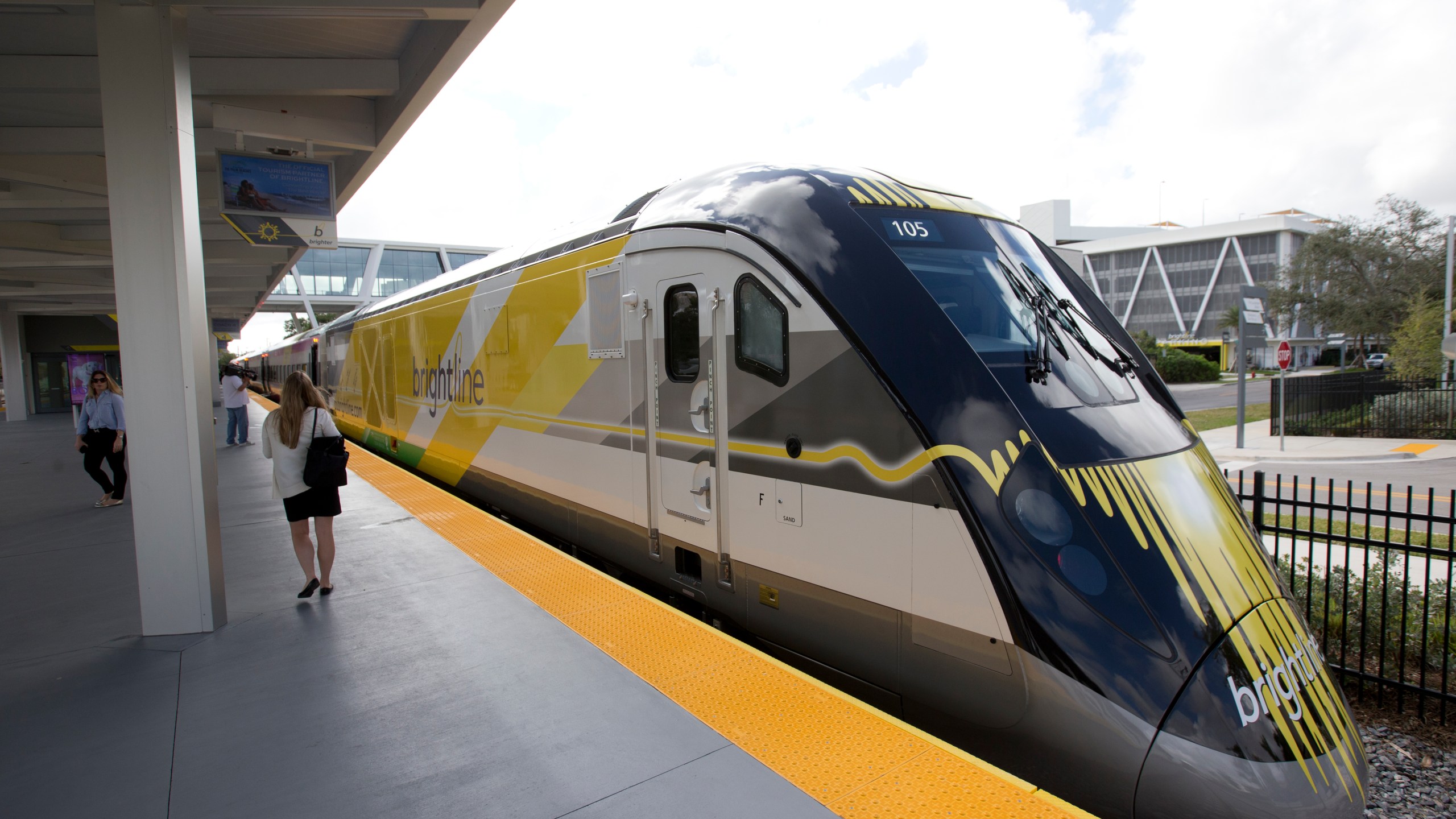 FILE - A Brightline train is shown at a station in Fort Lauderdale, Fla., on Jan. 11, 2018. A high-speed rail line between Las Vegas and the Los Angeles area is getting a Biden administration pledge of $3 billion to help start laying track. Nevada's two Democratic U.S. senators said Tuesday, Dec. 5, 2023 the $12 billion project led by Brightline West has all required right-of-way, environmental and labor approvals. (AP Photo/Wilfredo Lee, File)