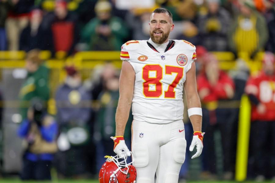 FILE - Kansas City Chiefs tight end Travis Kelce (87) warms up before an NFL football game, Dec. 3, 2023, in Green Bay, Wis. This year's lists of the most mispronounced words in the U.S. and Britain were released on Thursday, Dec. 7, by the online language learning company Babbel. Earning a place on the U.S. list was the last name of Kelce whose relationship with Taylor Swift has grabbed countless headlines. Whether Kelce should be pronounced with one or two syllables, Kels or KEL-See, has been a topic of discussion even in his own family. (AP Photo/Matt Ludtke, File)