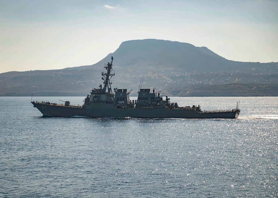 FILE - The guided-missile destroyer USS Carney in Souda Bay, Greece. The American warship and multiple commercial ships came under attack Sunday, Dec. 3, 2023 in the Red Sea, the Pentagon said, potentially marking a major escalation in a series of maritime attacks in the Mideast linked to the Israel-Hamas war. "We're aware of reports regarding attacks on the USS Carney and commercial vessels in the Red Sea and will provide information as it becomes available," the Pentagon said. (Petty Officer 3rd Class Bill Dodge/U.S. Navy via AP)