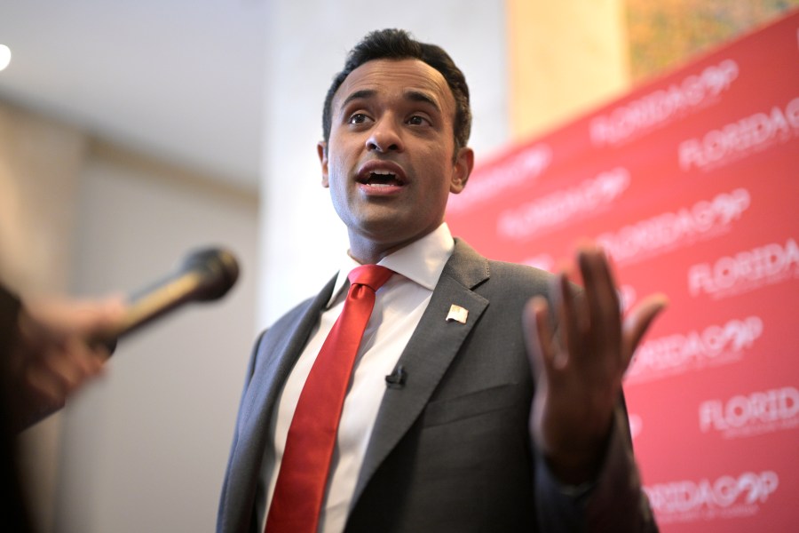 FILE - Republican presidential candidate Vivek Ramaswamy answers questions from reporters on Nov. 4, 2023, in Kissimmee, Fla. This year's lists of the most mispronounced words in the U.S. and Britain were released on Thursday, Dec. 7, by the online language learning company Babbel, and the biotech entrepreneur made the list. Ramaswamy's name is pronounced Vih-VAKE Rah-mah-SWAH-me. (AP Photo/Phelan M. Ebenhack, File)