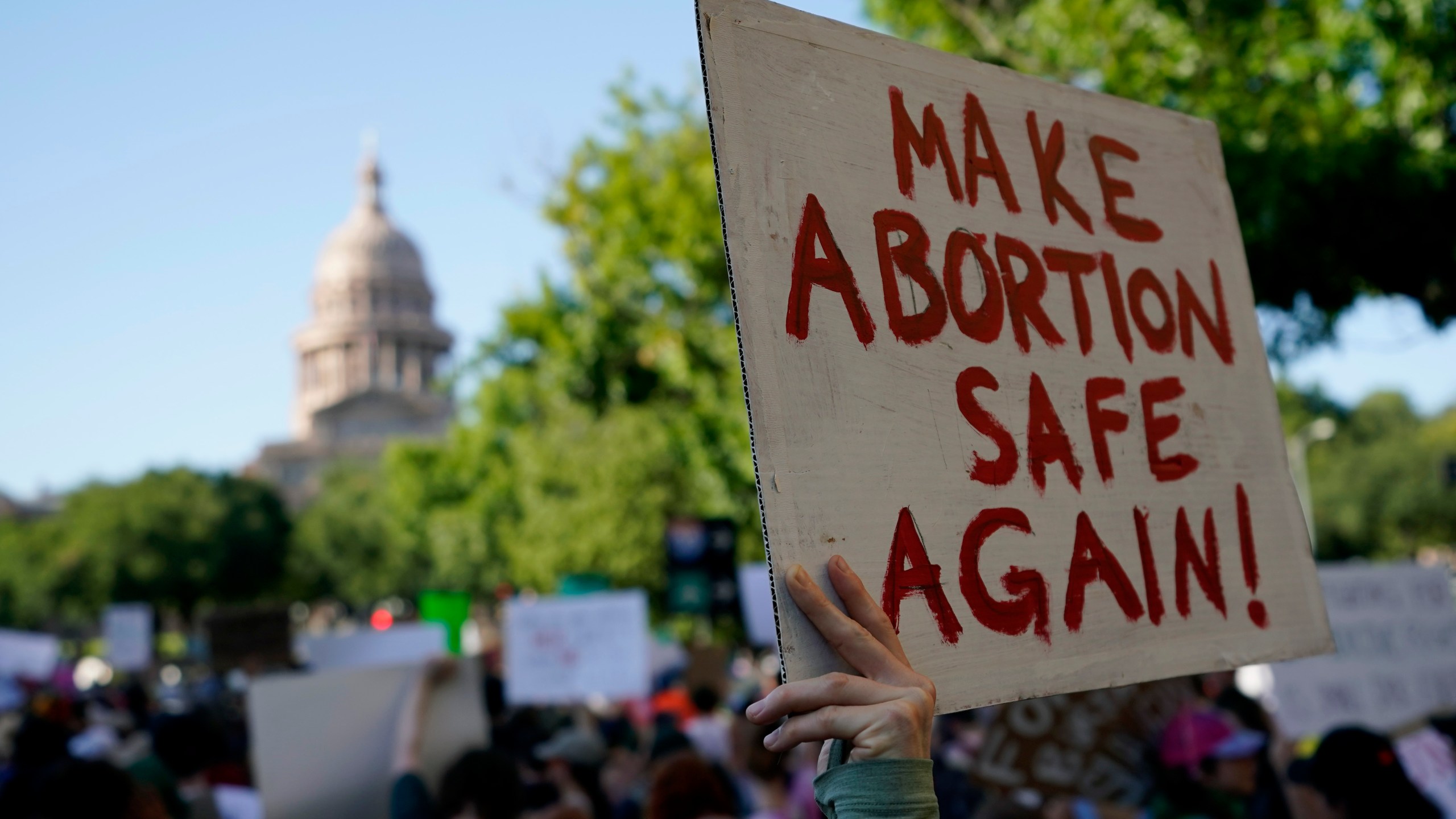 FILE - Demonstrators march and gather near the state capitol following the Supreme Court's decision to overturn Roe v. Wade, Friday, June 24, 2022, in Austin, Texas. A pregnant Texas woman whose fetus has a fatal diagnosis asked a court Tuesday, Dec. 5, 2023, to let her terminate the pregnancy, bringing what her attorneys say is the first lawsuit of its kind in the U.S. since Roe v. Wade was overturned last year. (AP Photo/Eric Gay, File)