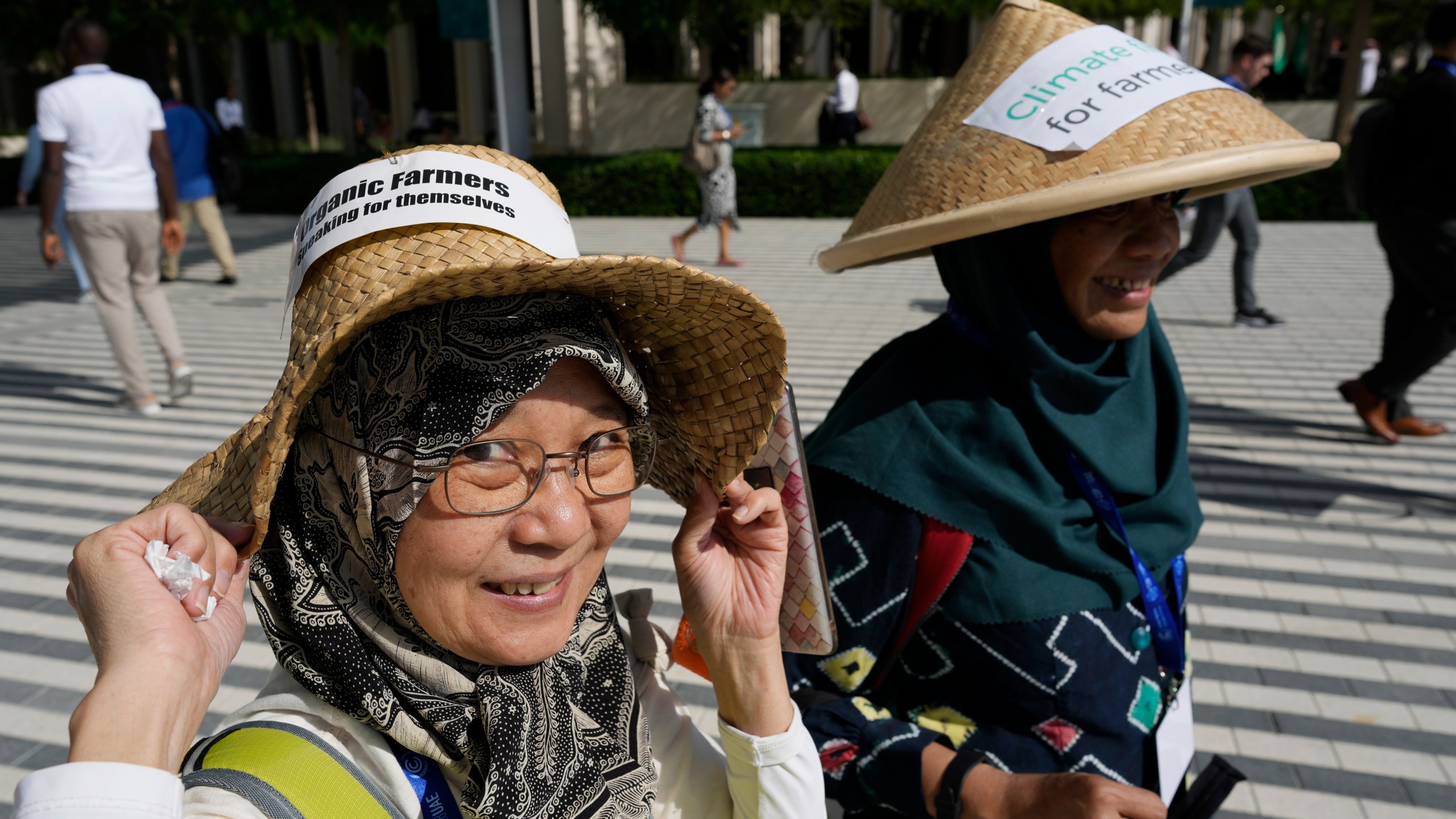 Demonstrators for climate for farmers walk through the COP28 U.N. Climate Summit, Saturday, Dec. 9, 2023, in Dubai, United Arab Emirates. (AP Photo/Peter Dejong)