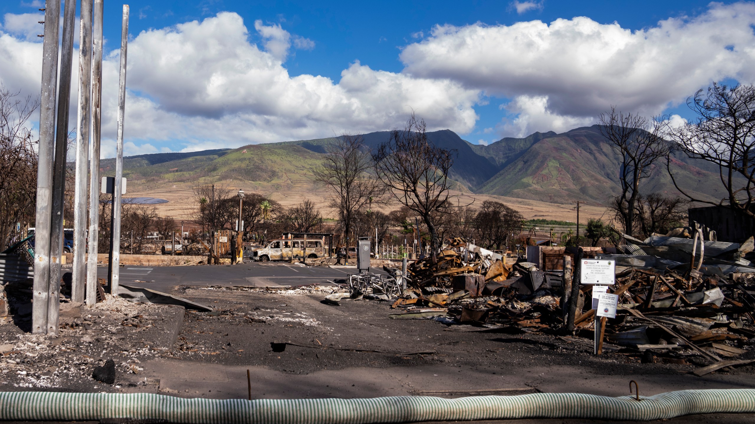 Debris of former shops and businesses on Front Street in burn zone 11A is pictured Dec. 8, 2023, in Lahaina, Hawaii. The area reopened Monday, Dec. 11, to residents and owners with entry passes. (AP Photo/Lindsey Wasson)