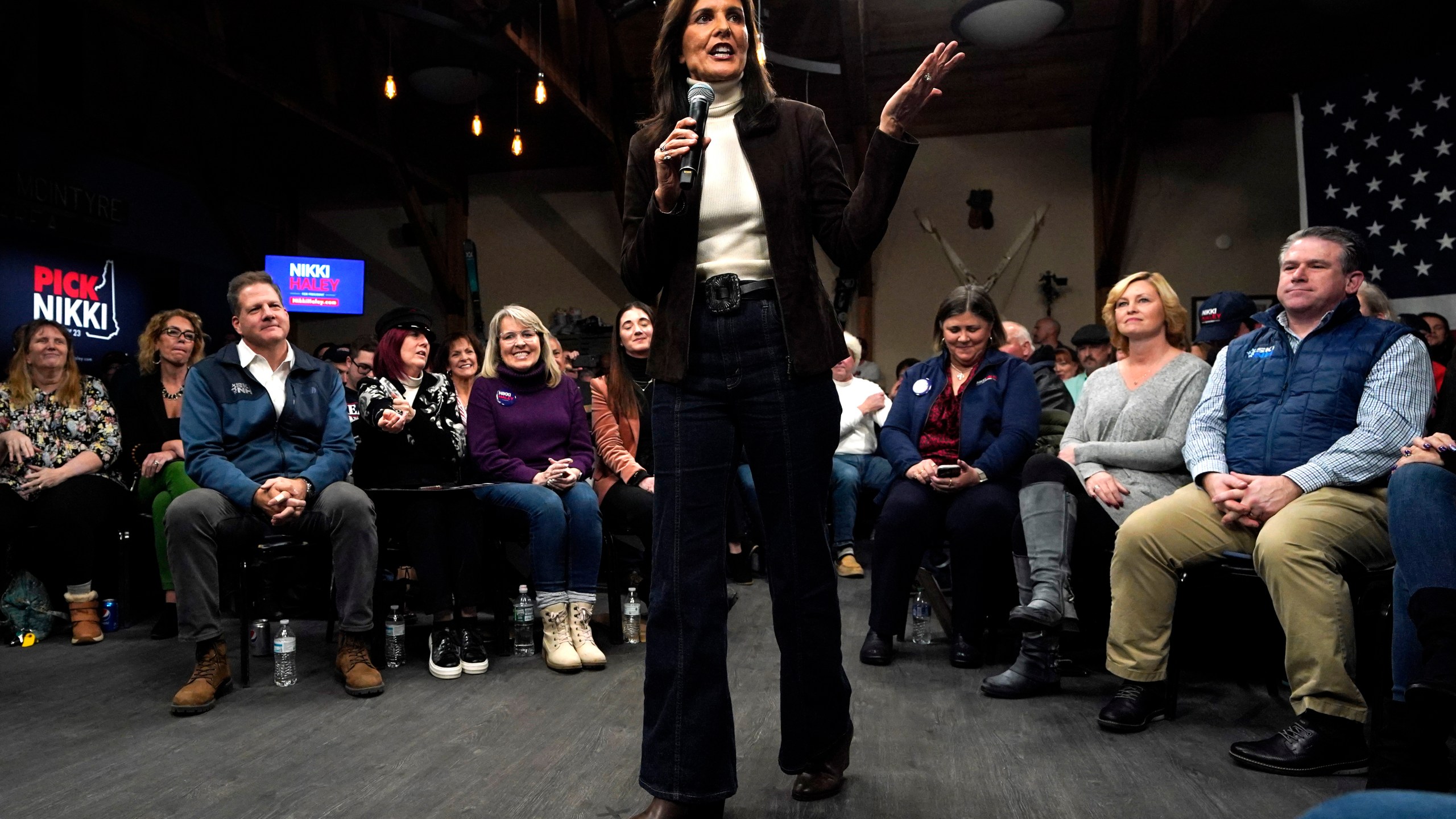 Republican presidential candidate Nikki Haley speaks at a town hall campaign event after receiving an endorsement from New Hampshire Gov. Chris Sununu, seated in the front row at left, Tuesday, Dec. 12, 2023, in Manchester, N.H. (AP Photo/Robert F. Bukaty)