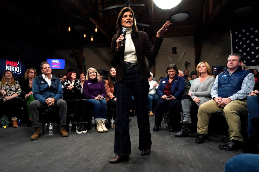 Republican presidential candidate Nikki Haley speaks at a town hall campaign event after receiving an endorsement from New Hampshire Gov. Chris Sununu, seated in the front row at left, Tuesday, Dec. 12, 2023, in Manchester, N.H. (AP Photo/Robert F. Bukaty)