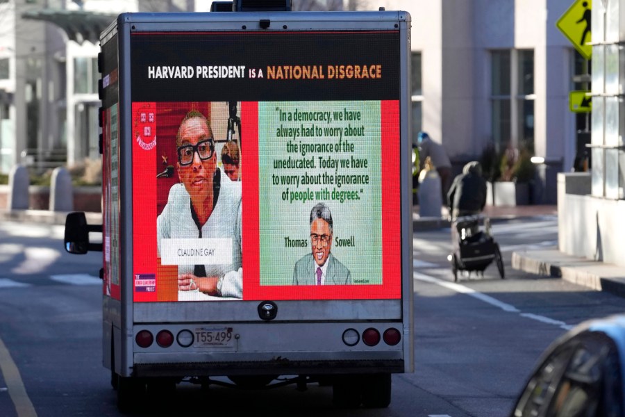 A truck with electronic panels drives along a street Tuesday, Dec. 12, 2023, near Harvard University, in Cambridge, Mass. The truck displays messages calling attention to a recent controversy involving testimony to Congress by presidents of three prestigious schools, including Harvard University, MIT, and the University of Pennsylvania. Harvard's highest governing body announced Tuesday that President Claudine Gay will remain leader of Harvard following her comments last week at a congressional hearing on antisemitism. (AP Photo/Steven Senne)