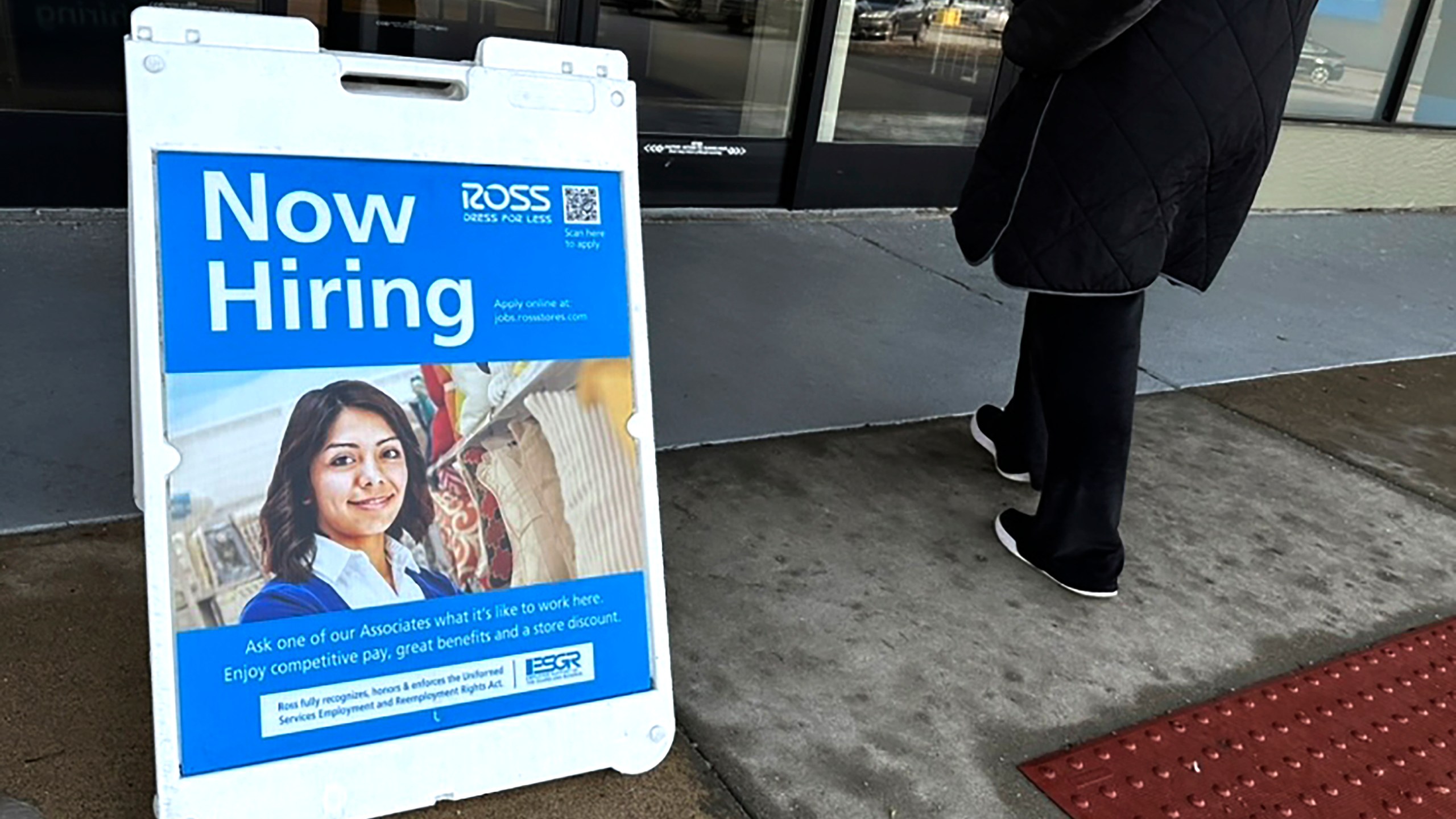 A hiring sign is displayed outside of a retail store in Schaumburg, Ill., Tuesday, Dec.12, 2023. On Thursday, the Labor Department reports on the number of people who applied for unemployment benefits last week. (AP Photo/Nam Y. Huh)