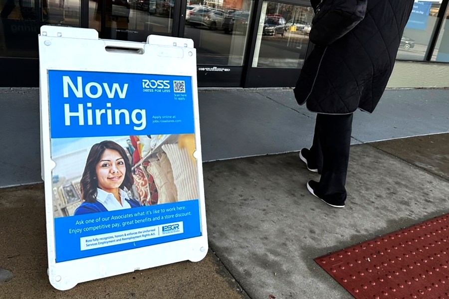 A hiring sign is displayed outside of a retail store in Schaumburg, Ill., Tuesday, Dec.12, 2023. On Thursday, the Labor Department reports on the number of people who applied for unemployment benefits last week. (AP Photo/Nam Y. Huh)