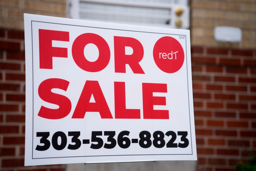 A for sale sign stands outside a single-family residence on Thursday, Nov. 23, 2023, in Denver. On Thursday, Freddie Mac reports on this week's average U.S. mortgage rates. (AP Photo/David Zalubowski)