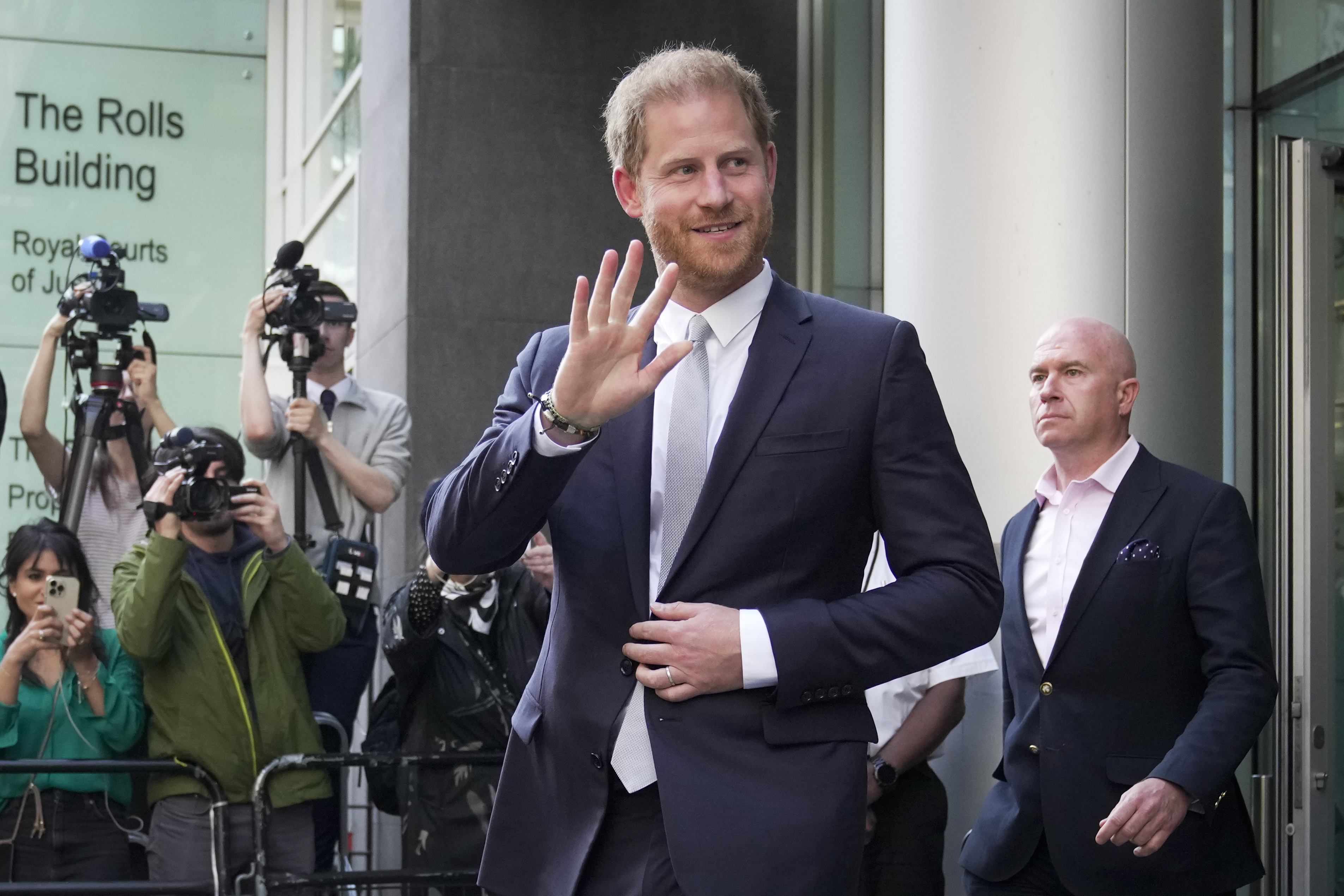 FILE - Prince Harry leaves the High Court after giving evidence in London, on June 7, 2023. Prince Harry won his phone hacking lawsuit Friday Dec. 15, 2023 against the publisher of the Daily Mirror and was awarded over 140,000 pounds ($180,000) in the first of his several lawsuits against the tabloids to go to trial. (AP Photo/Kin Cheung, File)