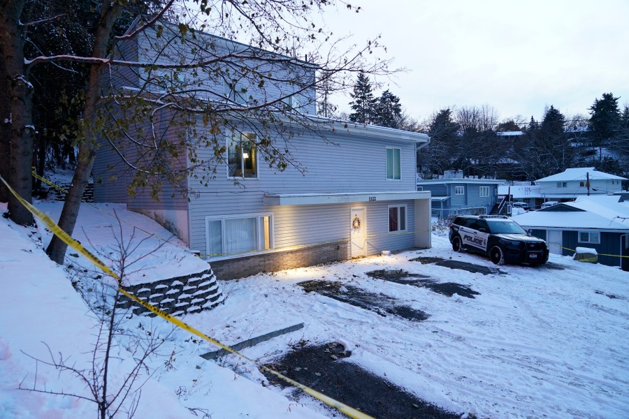 FILE - Bare spots are seen on Nov. 29, 2022, in the snowy parking lot in front of the home where four University of Idaho students were found dead on Nov. 13, in Moscow, Idaho, after vehicles belonging to the victims and others were towed away earlier in the day. The defense team for a man accused of killing four University of Idaho students has been given access to the off-campus home where the deaths occurred so they can gather photos, measurements and other documentation before the house is demolished later this month. (AP Photo/Ted S. Warren, File)