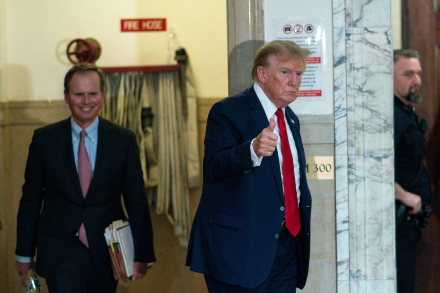 Former President Donald Trump gives a thumbs up as he returns to the courtroom from a break at New York Supreme Court, Thursday, Dec. 7, 2023, in New York. (AP Photo/Eduardo Munoz Alvarez)