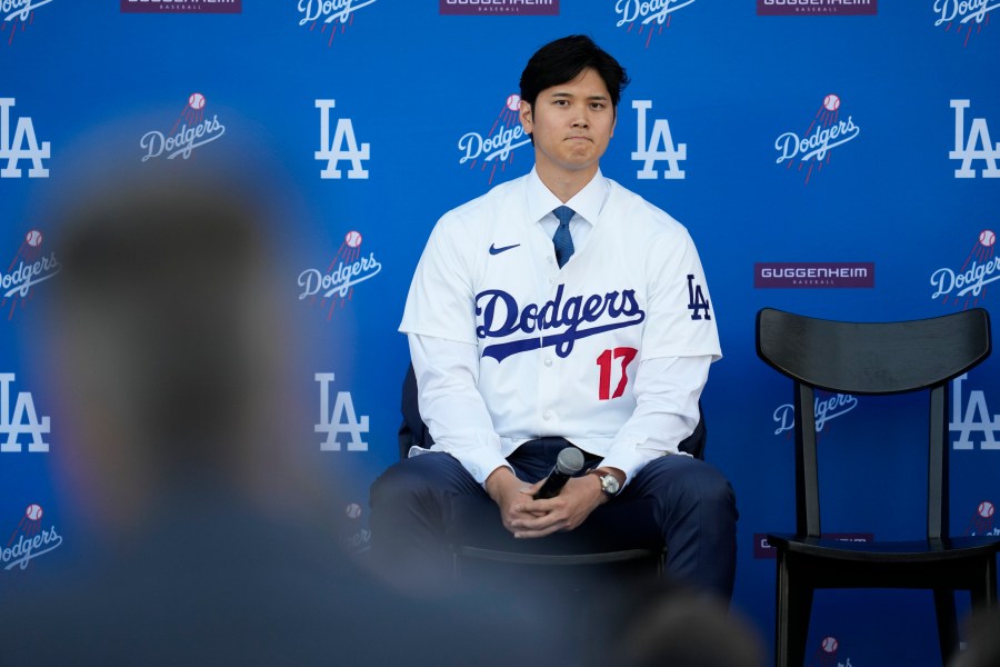 Los Angeles Dodgers' Shohei Ohtani listens to questions during a baseball news conference at Dodger Stadium Thursday, Dec. 14, 2023, in Los Angeles. (AP Photo/Ashley Landis)