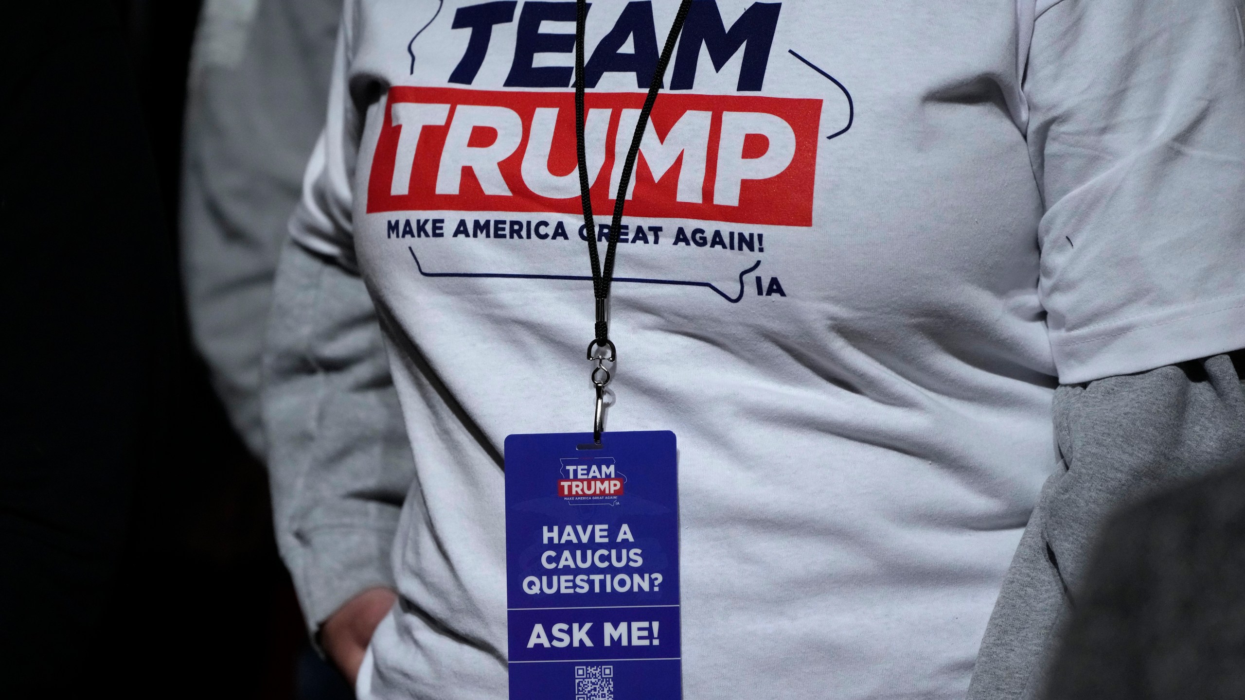 FILE - An audience member waits for former President Donald Trump to arrive at a commit to caucus rally, Sunday, Oct. 29, 2023, in Sioux City, Iowa. Trump is pushing his supporters to deliver a blowout win in the Iowa caucuses one month away. Unlike his first time in the caucuses, Trump’s campaign is now run by Iowa veterans who are not just locking in caucus commitments but building a formidable organization to try to lock in his lead. (AP Photo/Charlie Neibergall, File)