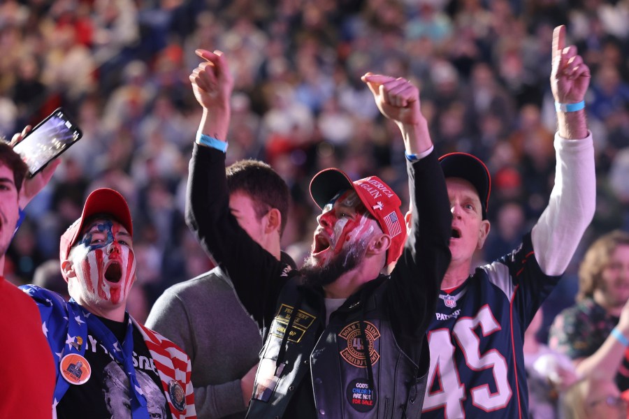 CAPTION CORRECTION CORRECTS DATE: Attendees cheer during a campaign rally for former president Donald Trump, Saturday, Dec. 16, 2023, in Durham, N.H. (AP Photo/Reba Saldanha)