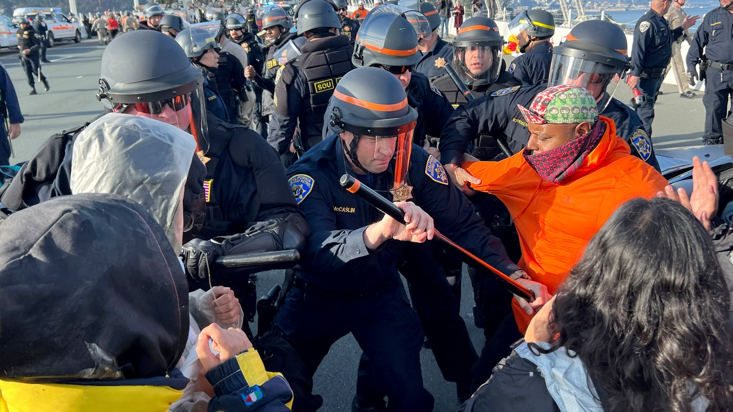 FILE - Demonstrators clash with police as arrests are made after shutting down the San Francisco Oakland Bay Bridge in conjunction with the APEC Summit taking place Thursday, Nov. 16, 2023, in San Francisco. San Francisco's District Attorney's Office on Monday began charging demonstrators who blocked traffic for hours last month on the Bay Bridge to demand a cease-fire in Gaza.(AP Photo/Noah Berger, File)