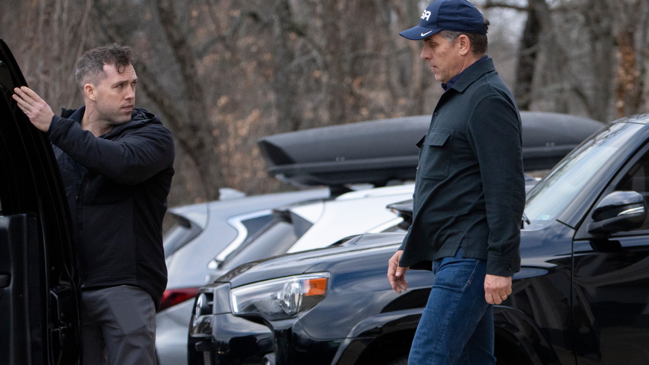 Hunter Biden walks to a presidential vehicle after accompanying his father, President Joe Biden, at a store in Greenville, Del., Monday, Dec. 18, 2023. (AP Photo/Manuel Balce Ceneta)