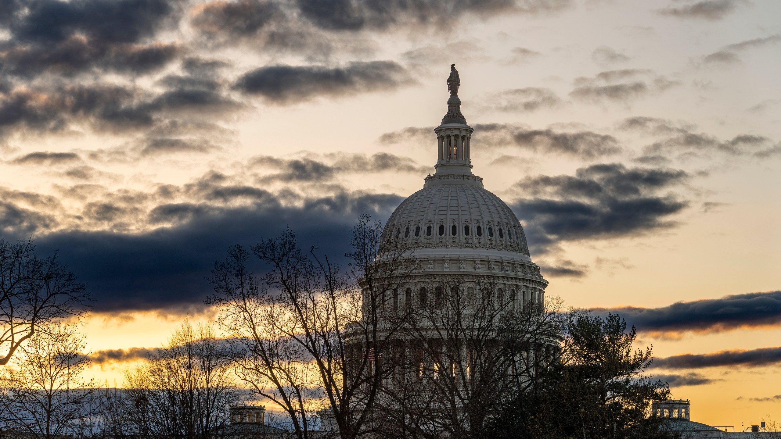 The Capitol is seen under a winter sky in Washington, Monday, Dec. 18, 2023, as White House and Senate negotiators are struggling to reach a U.S. border security deal that would unlock President Joe Biden's request for billions of dollars worth in military aid for Ukraine and national security. (AP Photo/J. Scott Applewhite)