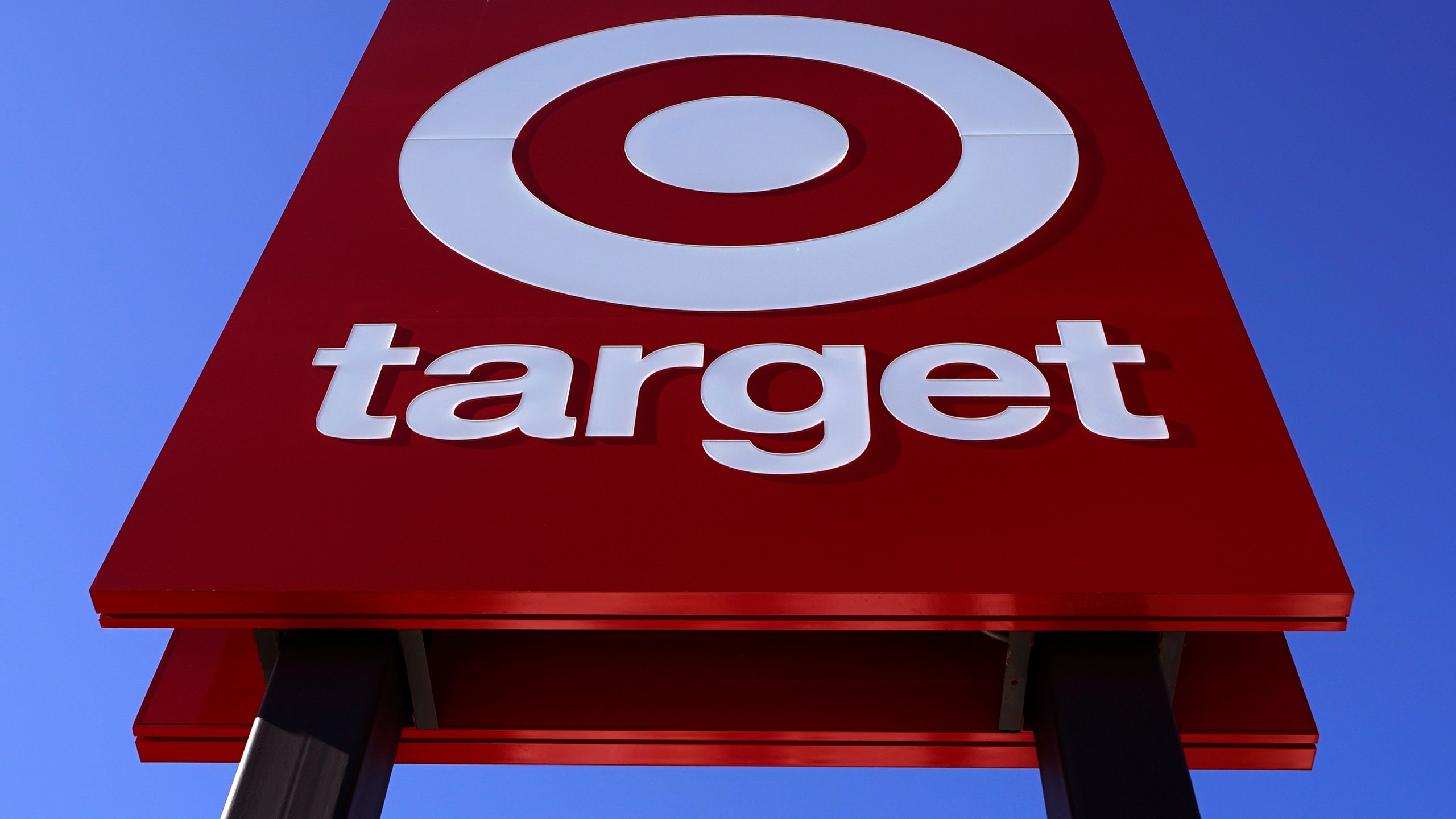 FILE - A Target sign is shown outside a store on Feb. 28, 2022. Walmart, Target and Amazon are all-in on the shipping wars, a move retail experts say will help them maintain a competitive edge against low-cost Chinese retailers Shein and Temu. (AP Photo/Charles Krupa, File)